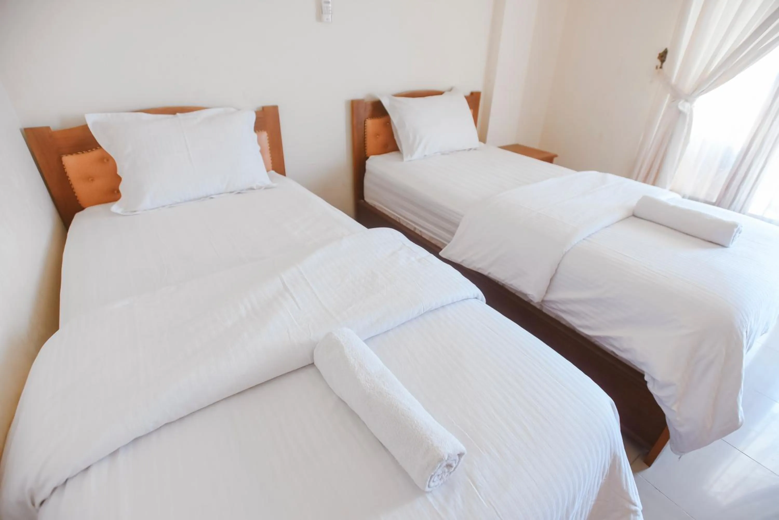 Bed in CHRYSANT HOTEL & RESORT