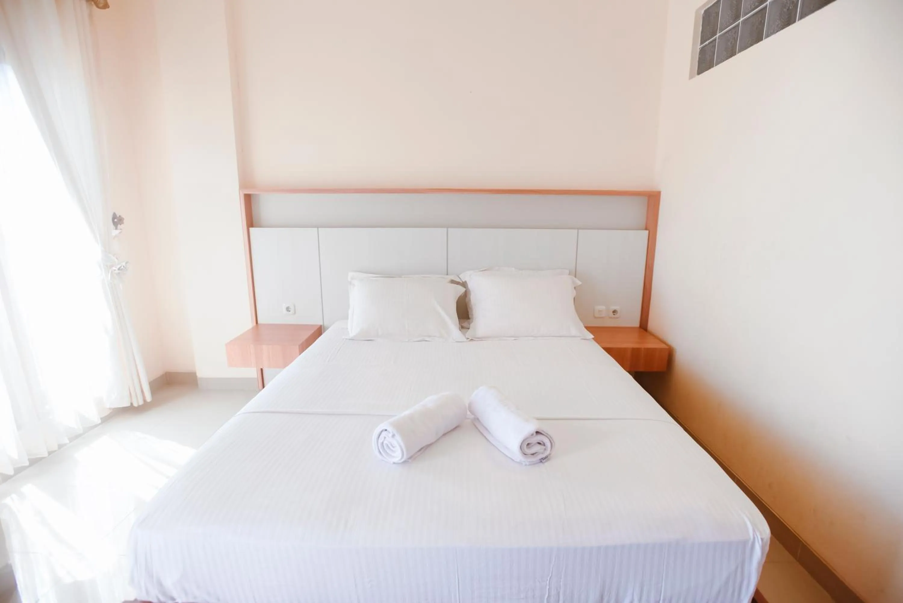 Bed in CHRYSANT HOTEL & RESORT