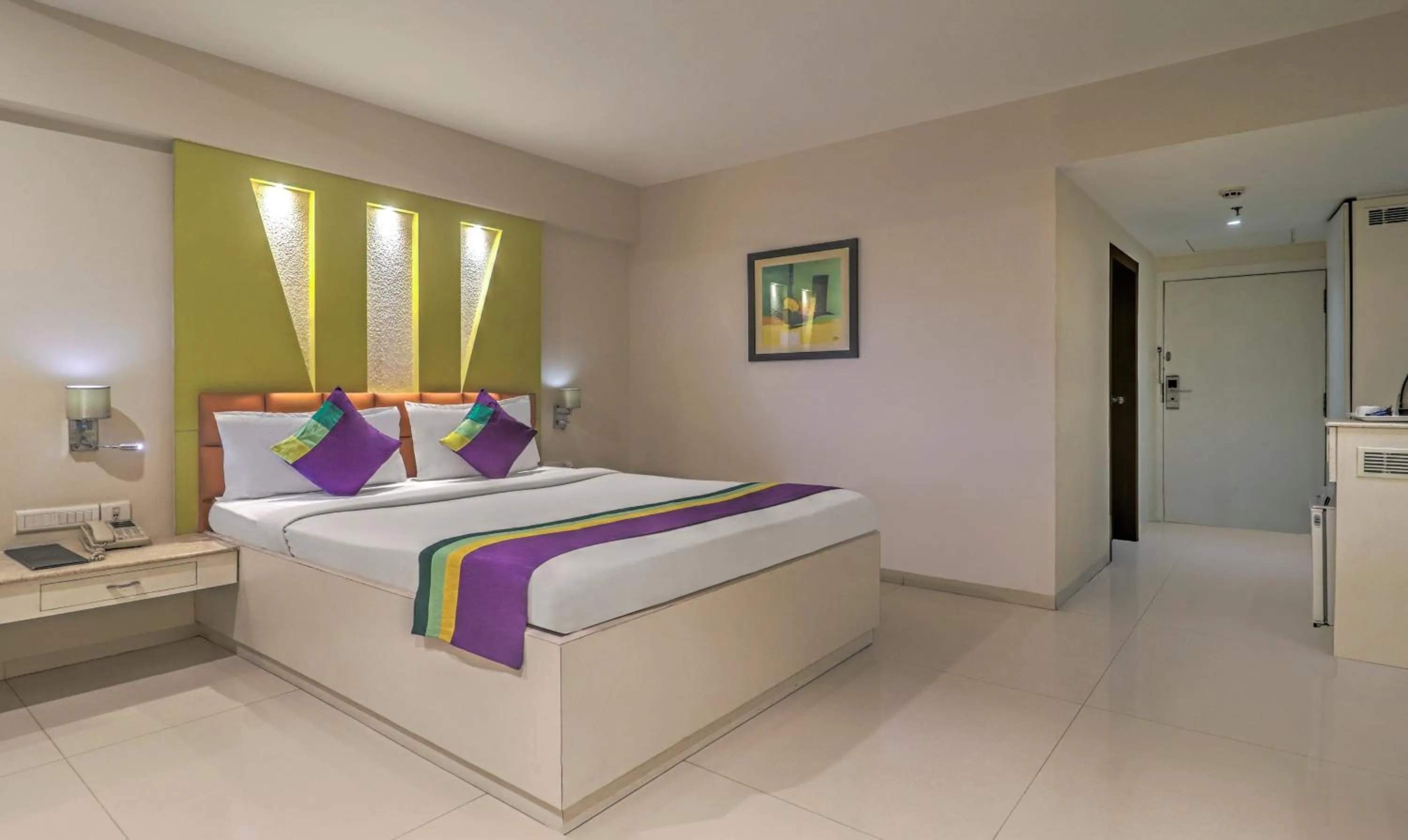 Bedroom, Bed in Treebo Premium Metropolis