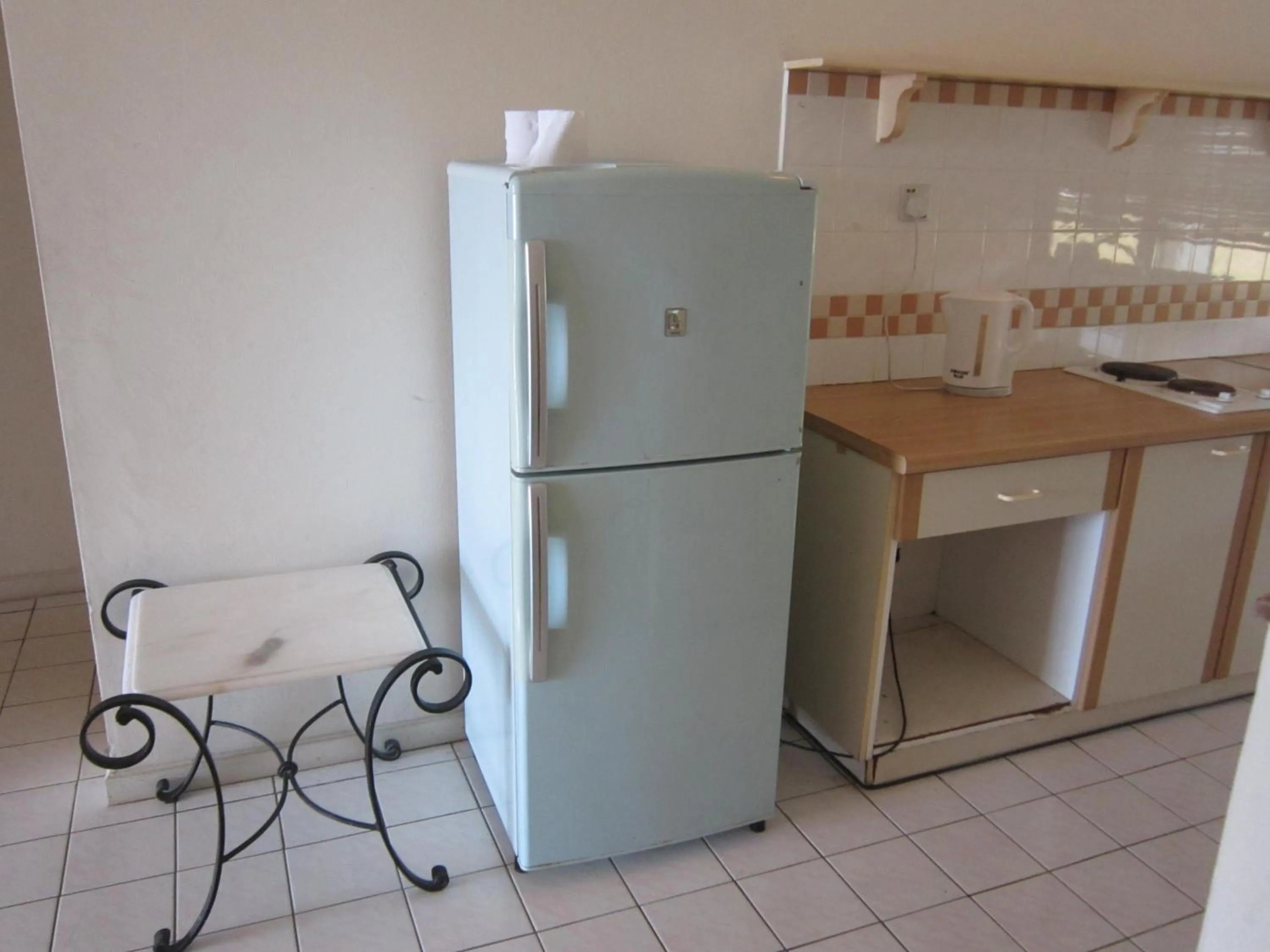 Kitchen or kitchenette in Paradise Lagoon Apartment