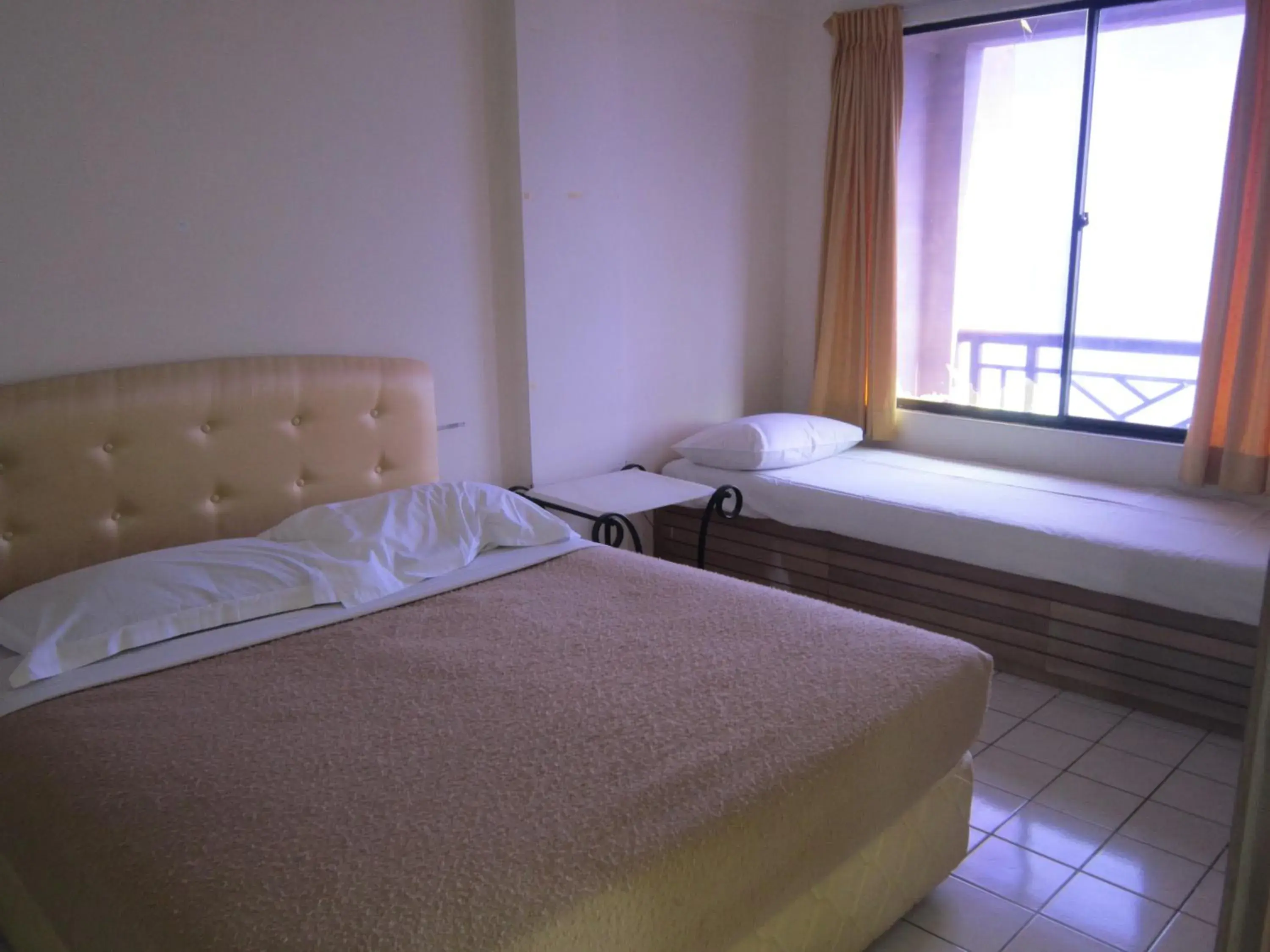 Bed in Paradise Lagoon Apartment Bed in Paradise Lagoon Apartment