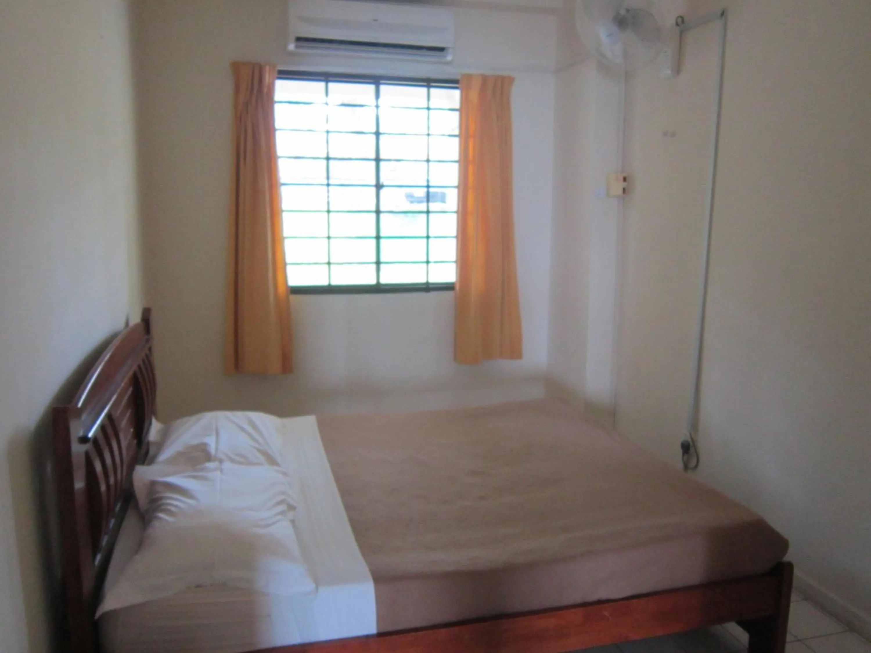 Bed in Paradise Lagoon Apartment