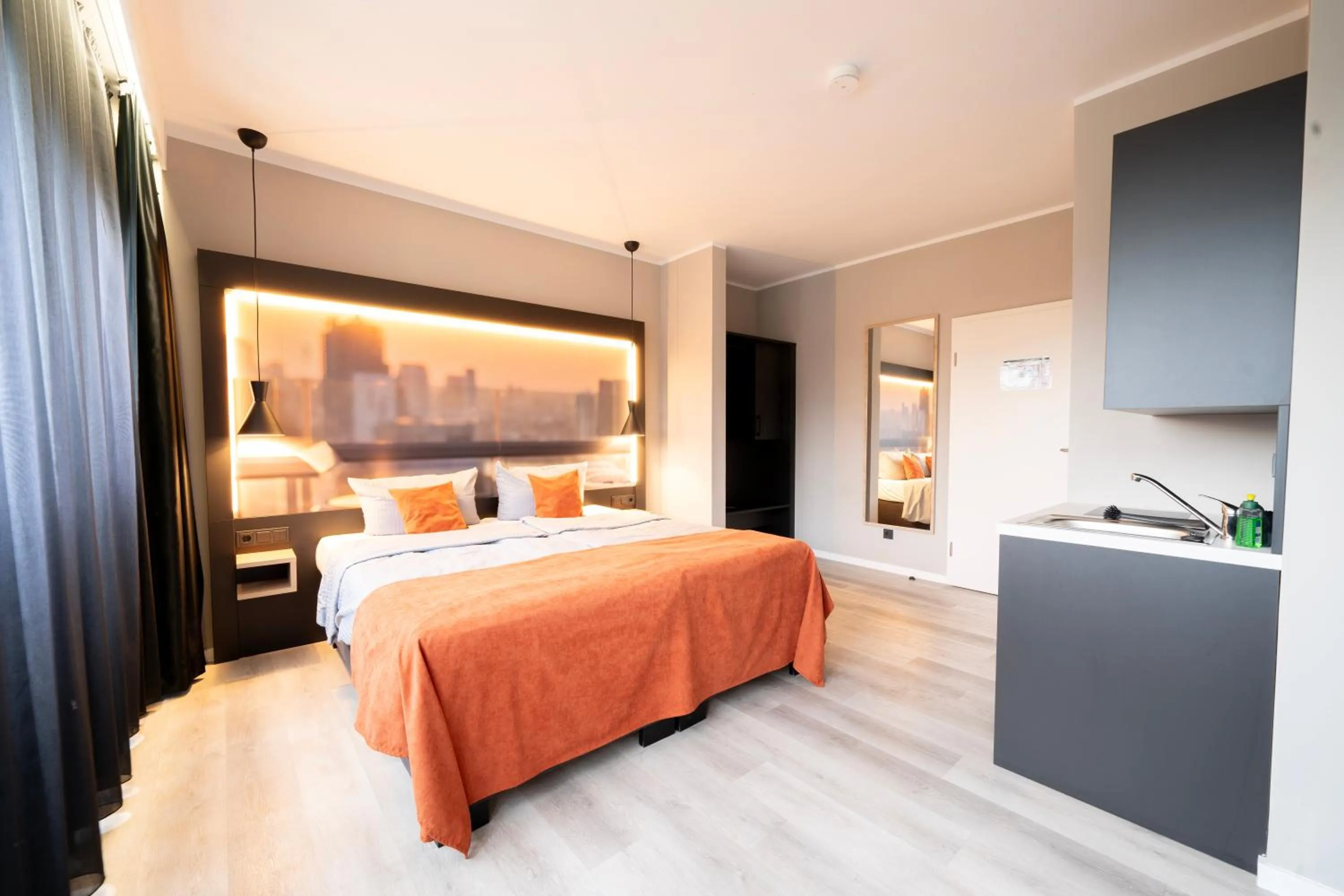 Kitchen or kitchenette, Bed in JustStay Mülheim Hotel & Apartments