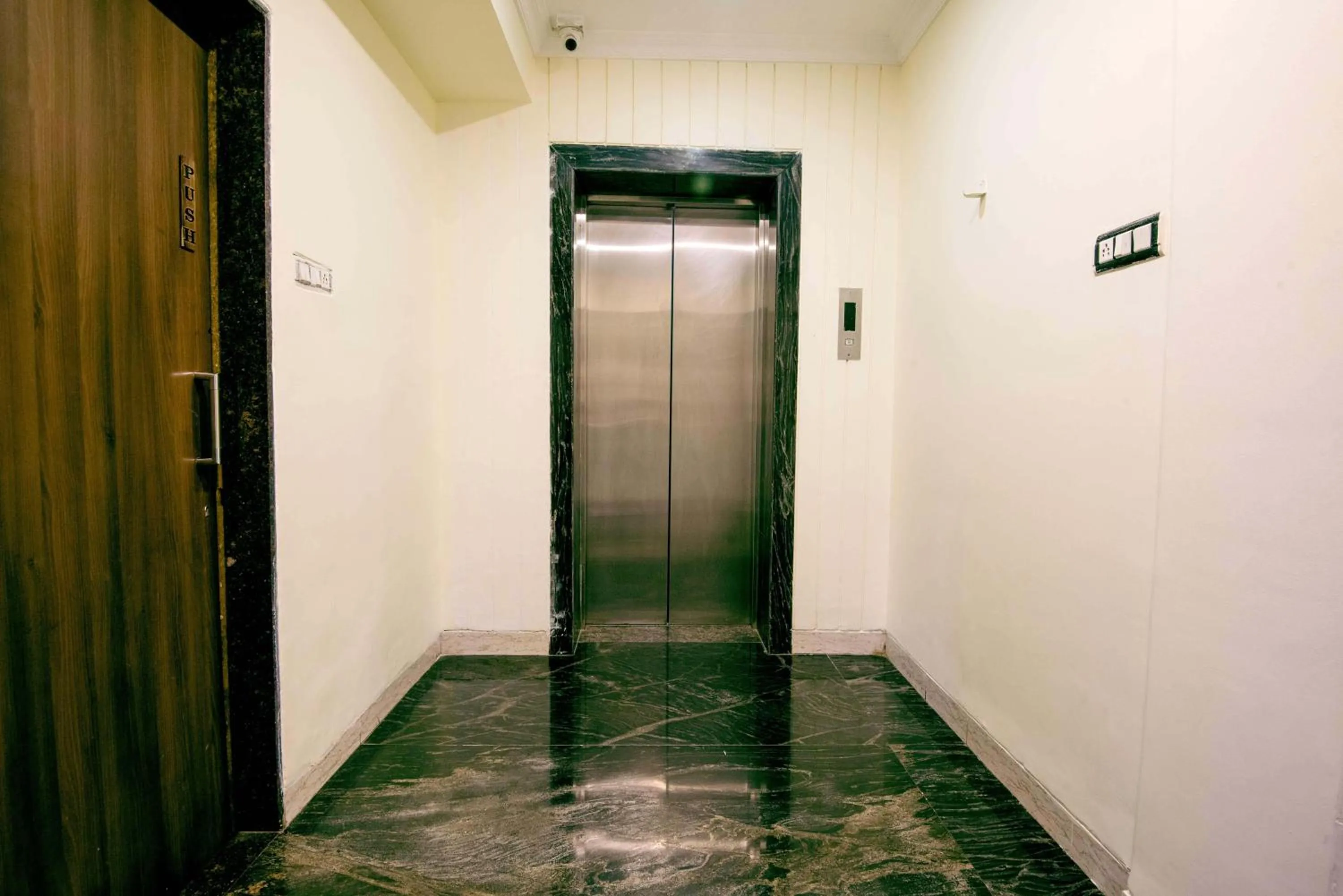 elevator in Treebo Reveniir Resort with Pool