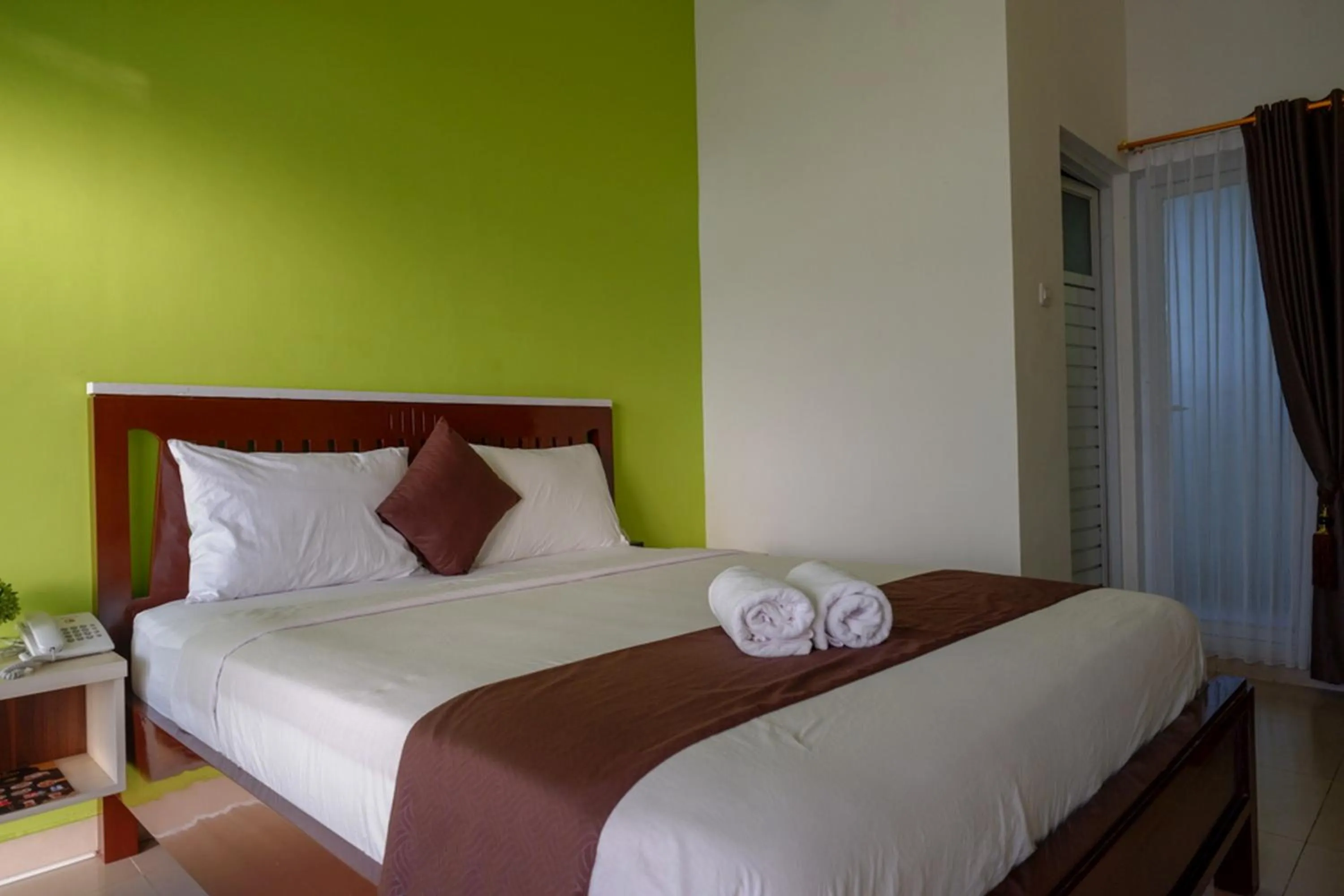 Bed in RedDoorz Syariah at Omah Sawah