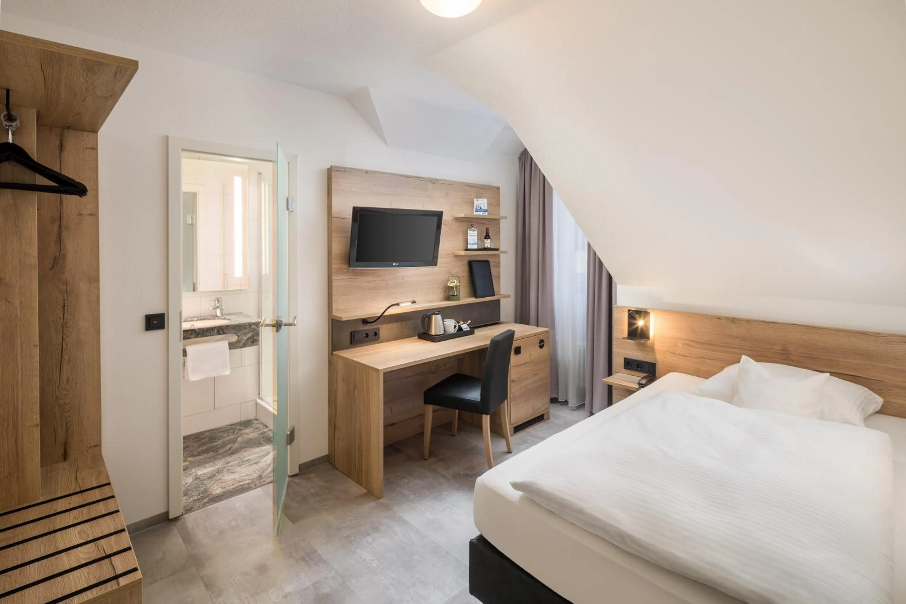 Living room, Bed in Best Western Hotel Favorit