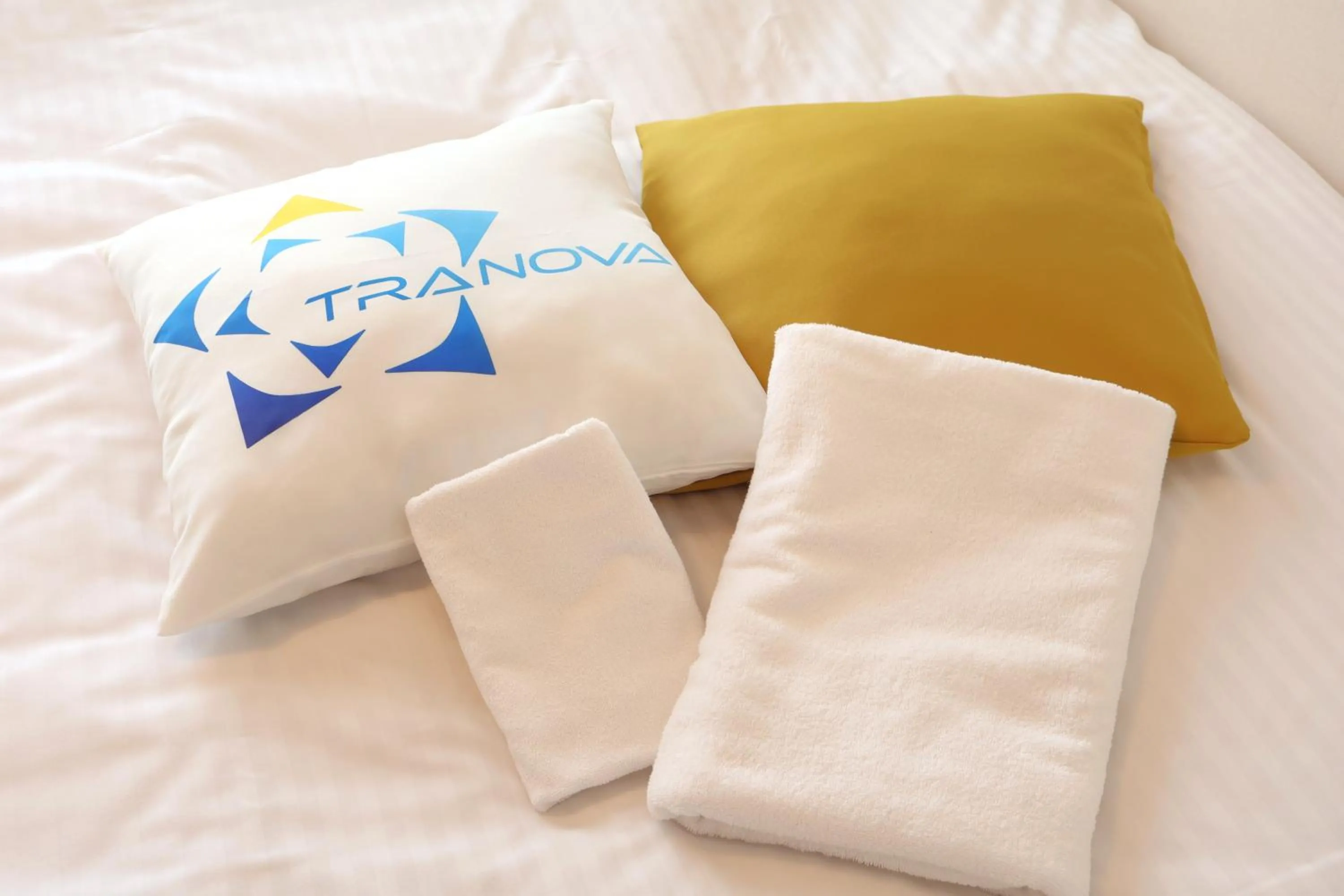 towels, Bed in Chill Inn Honan by Tranova
