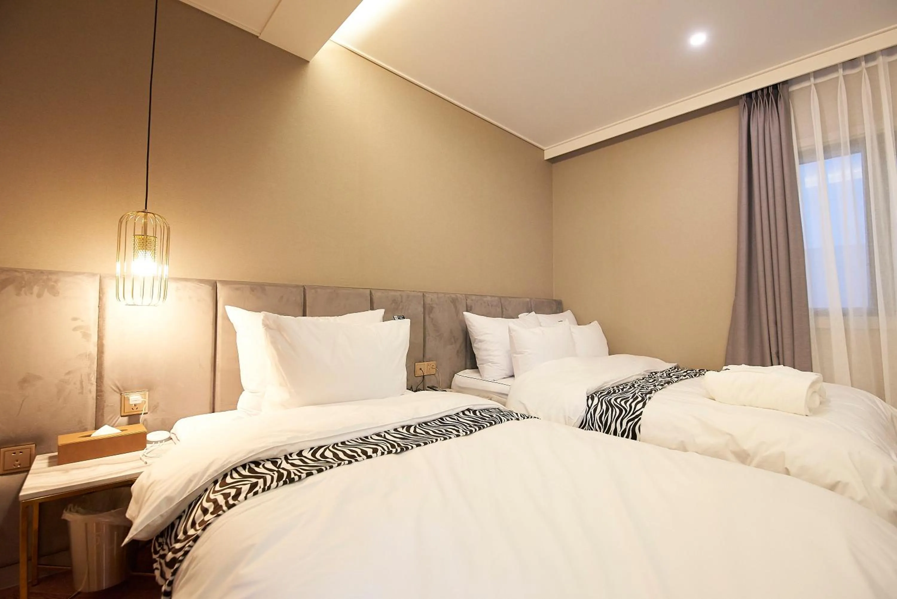 Bed in Denbasta Hotel
