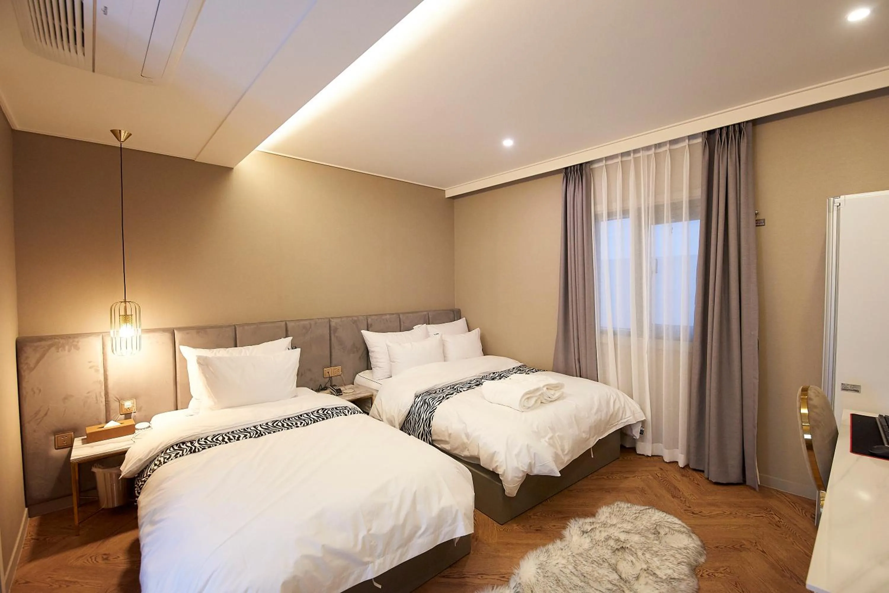 Bed in Denbasta Hotel