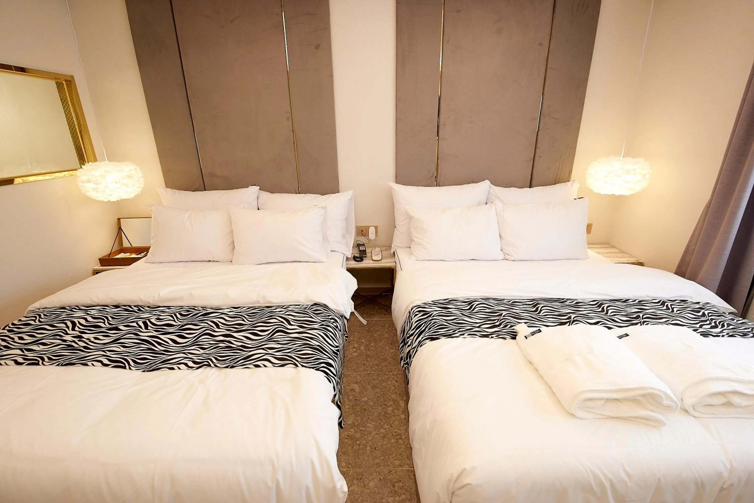 Bed in Denbasta Hotel