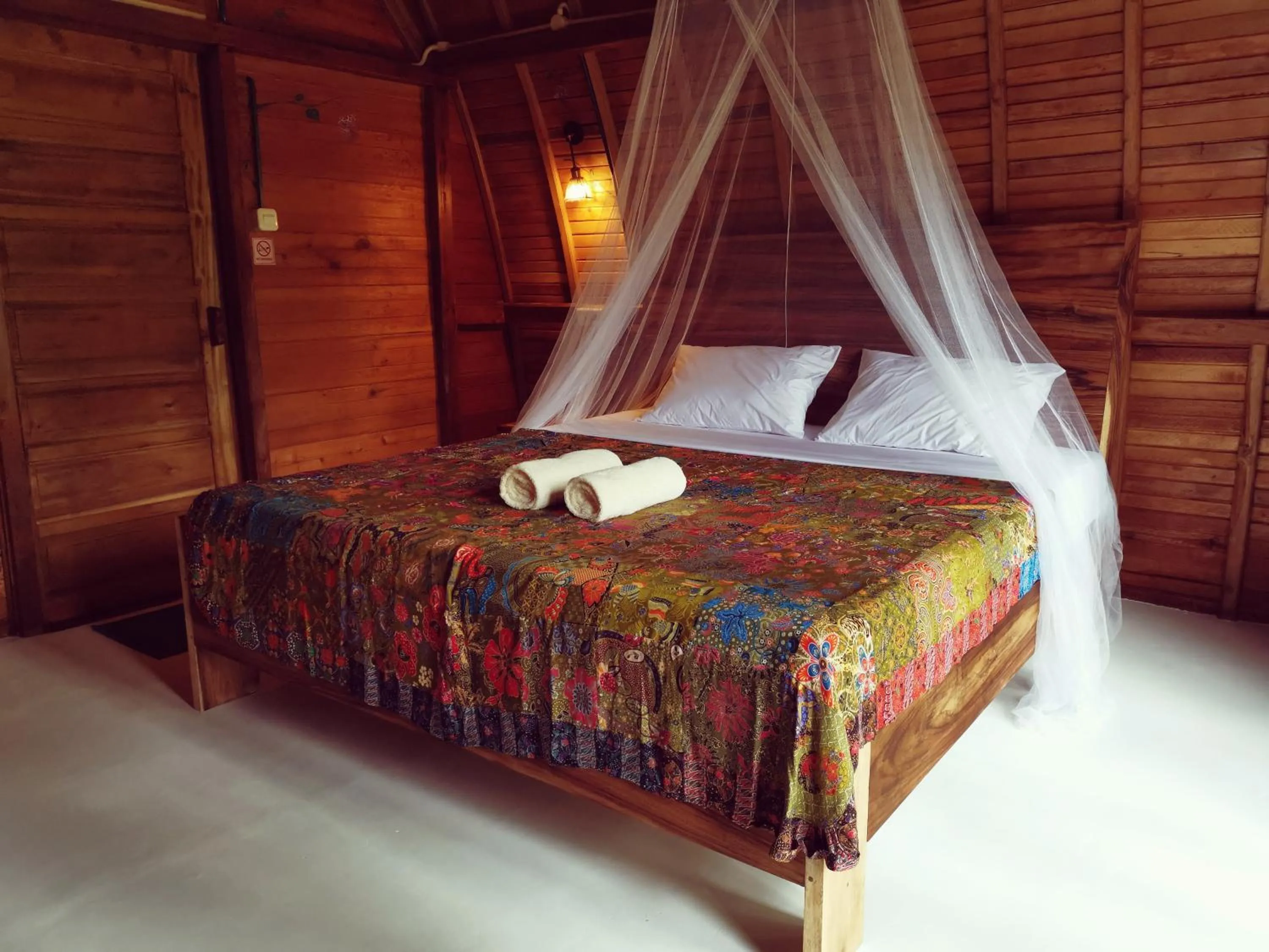 Bed in Coconut Tree Cottages