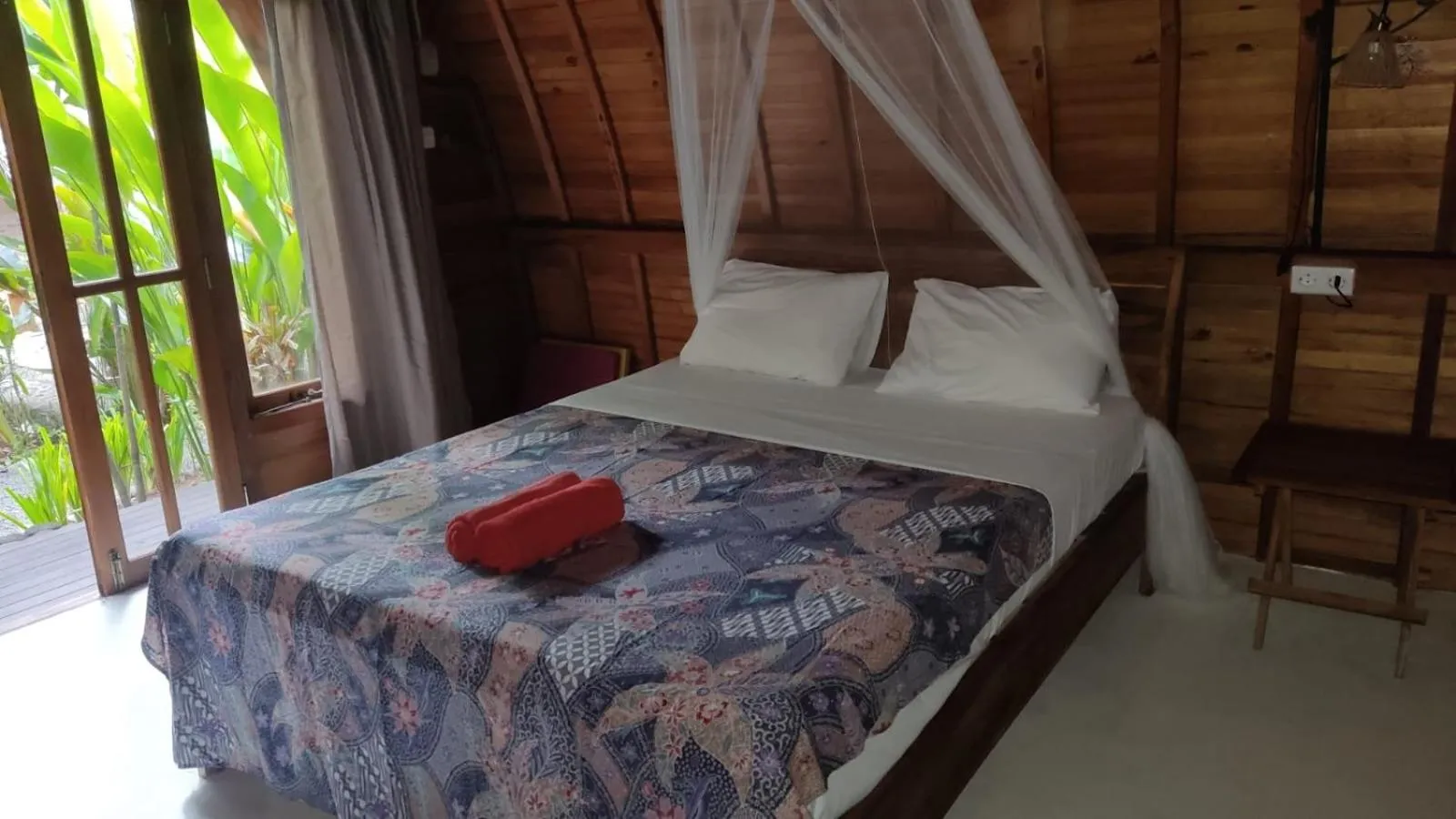 Bed in Coconut Tree Cottages