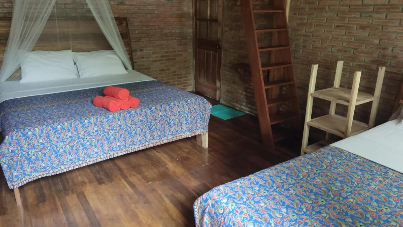 Bed in Coconut Tree Cottages