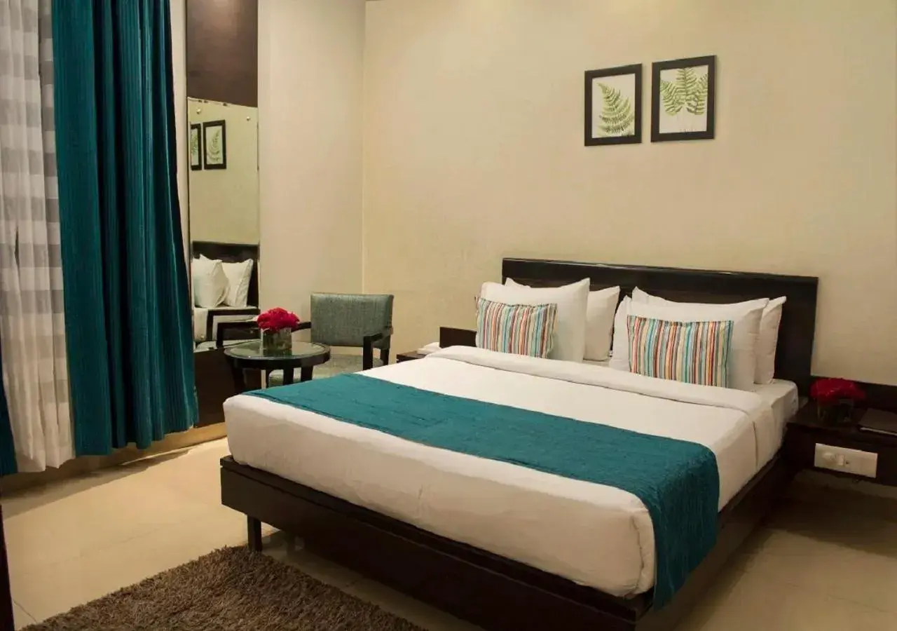 Bedroom, Bed in Hotel Rockland Panchsheel Enclave Bedroom, Bed in Hotel Rockland Panchsheel Enclave