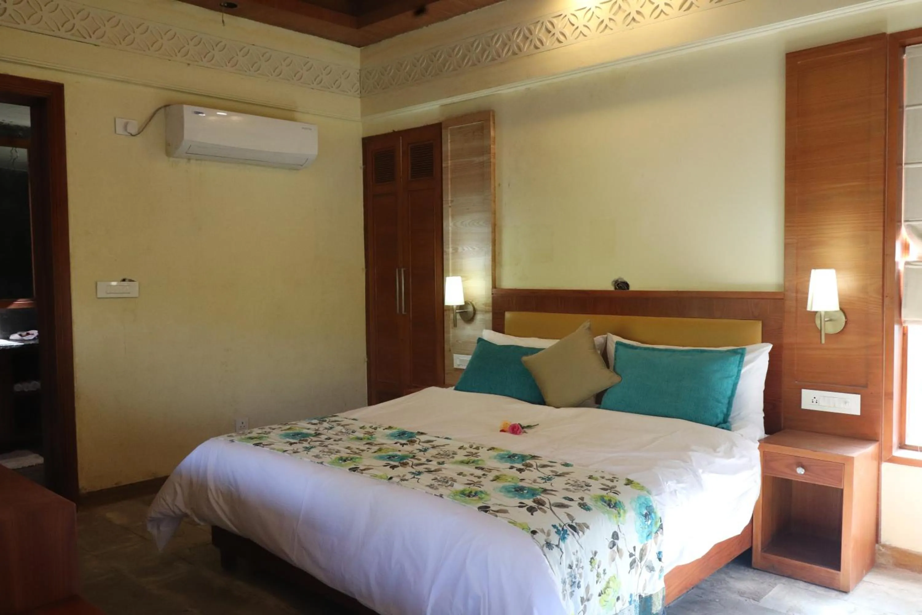 Bed in Punarnava Resort & Spa