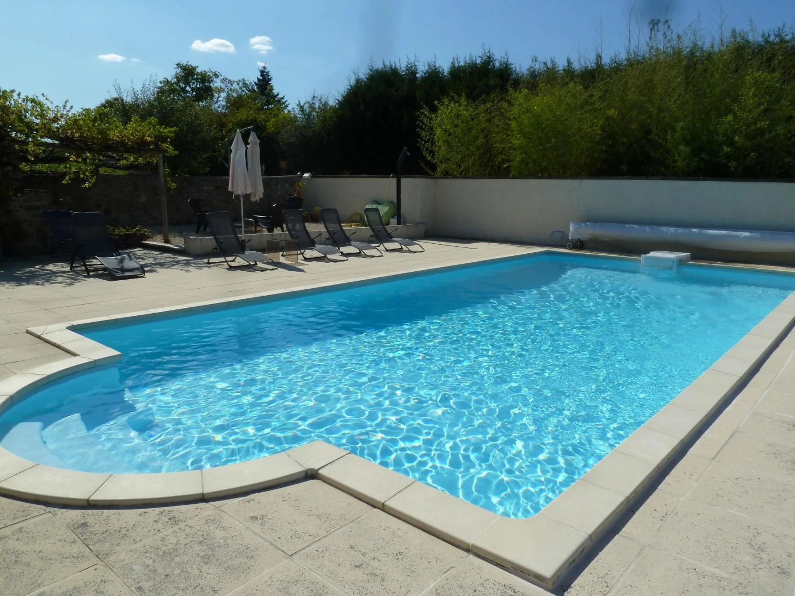 Swimming pool in A L'Ombre Du Marronnier GITES