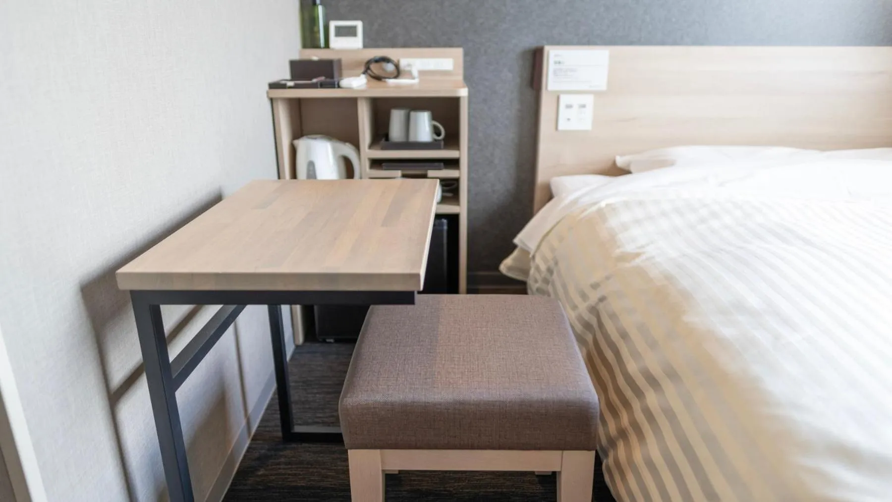 Bed in Super Hotel Kanku Kumatoriekimae