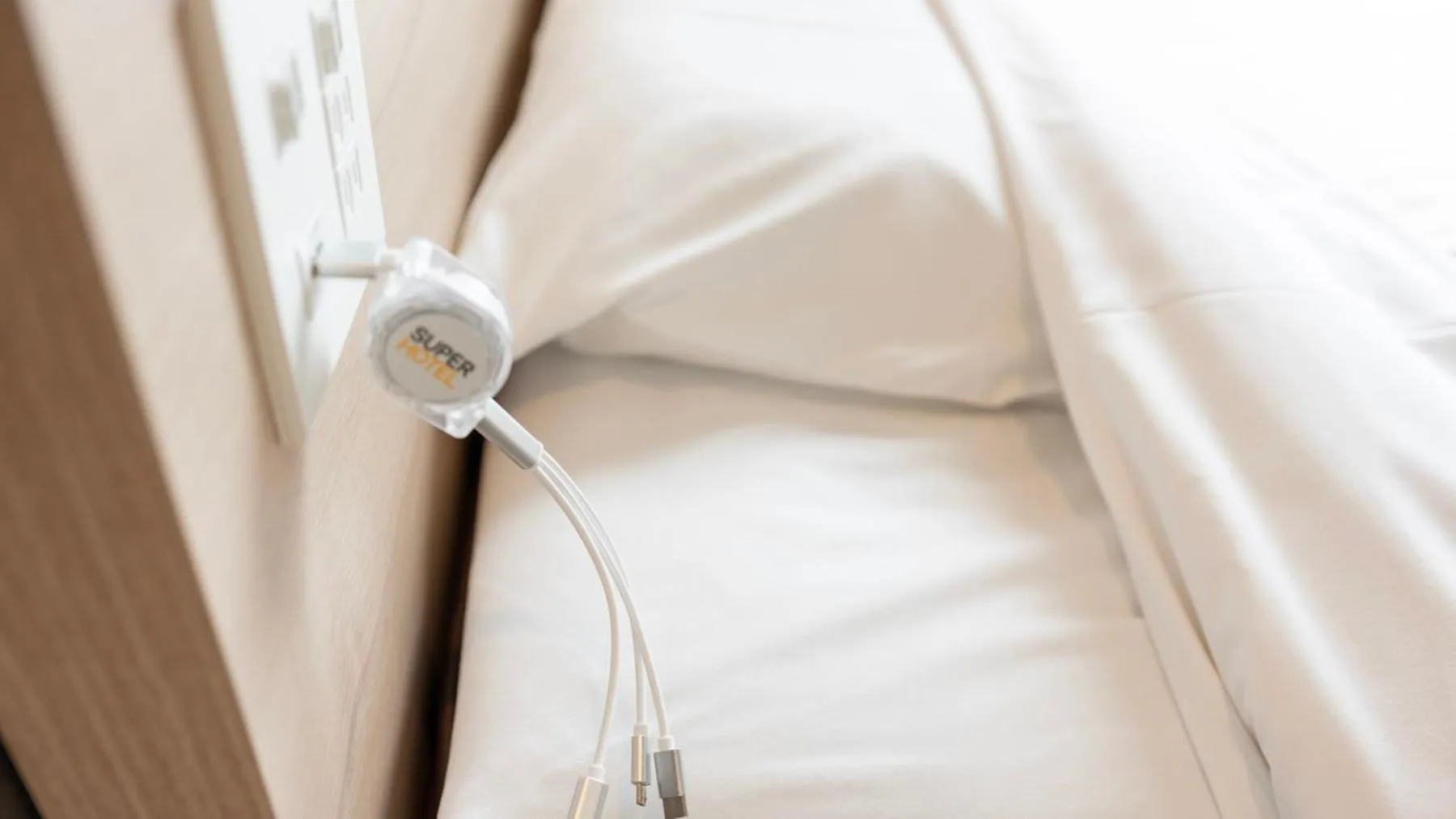 Bed in Super Hotel Kanku Kumatoriekimae