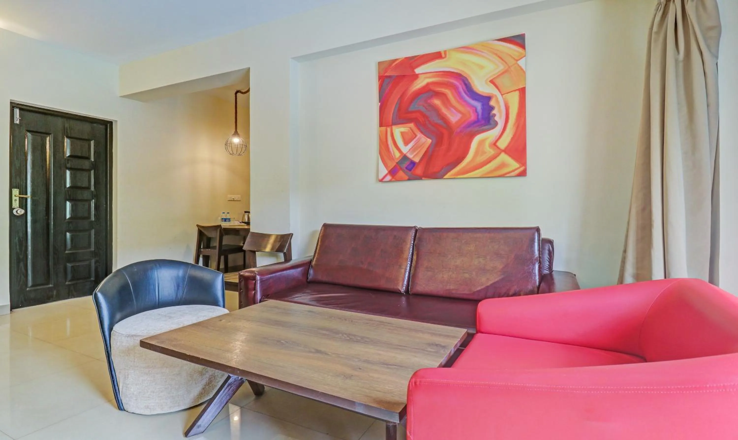 Seating area in Treebo Aquamarine Arpora With Pool