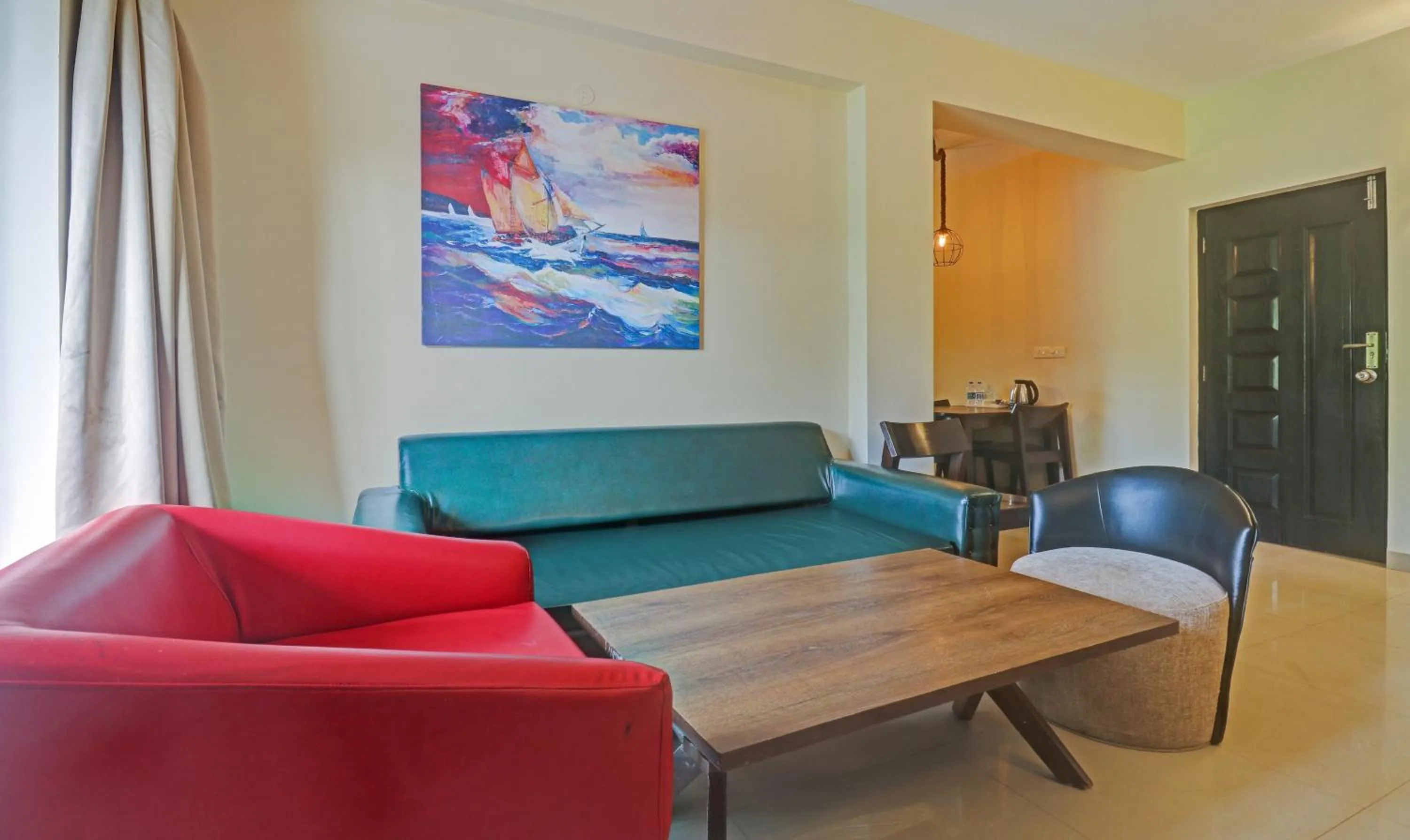 Seating area in Treebo Aquamarine Arpora With Pool