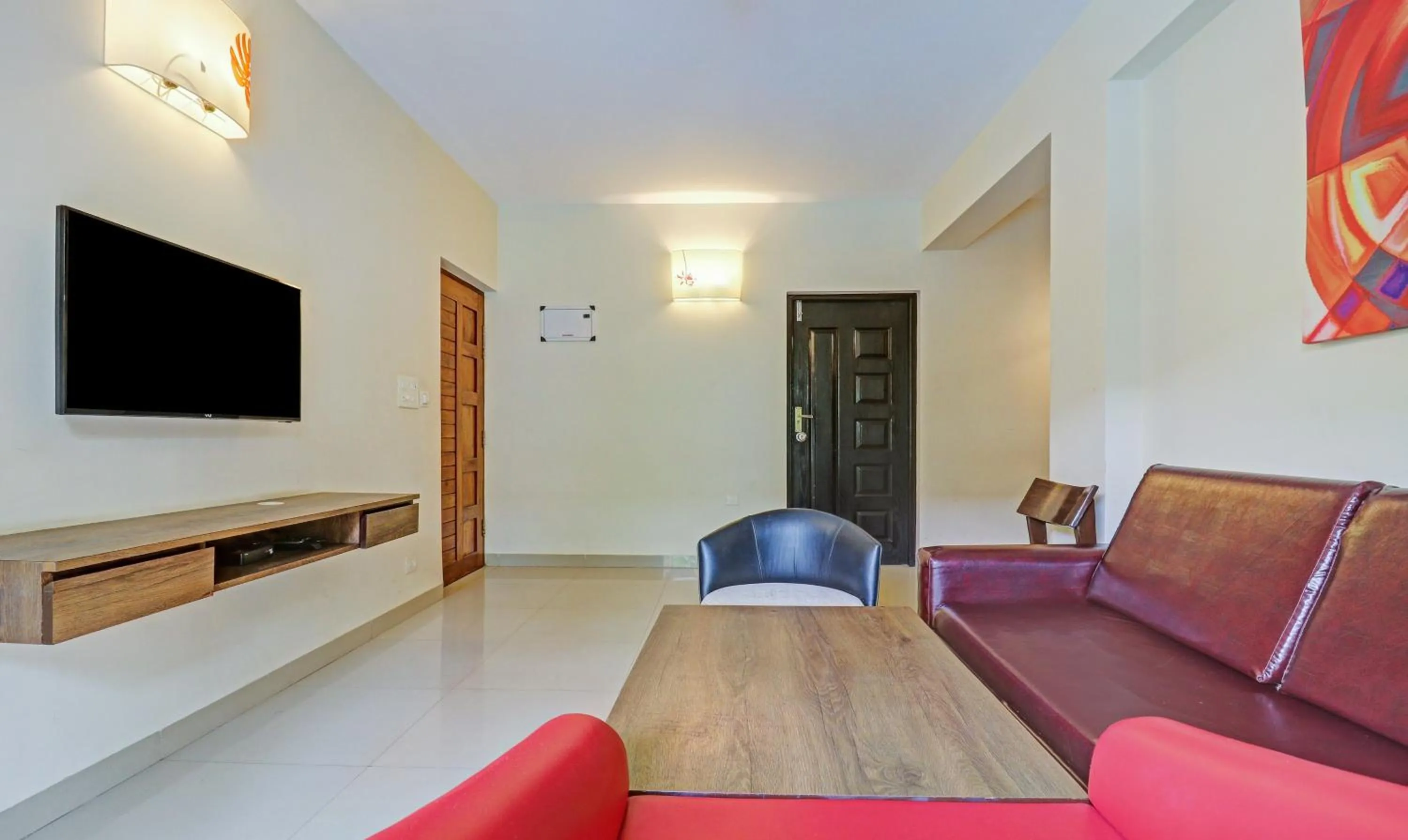 Seating area in Treebo Aquamarine Arpora With Pool