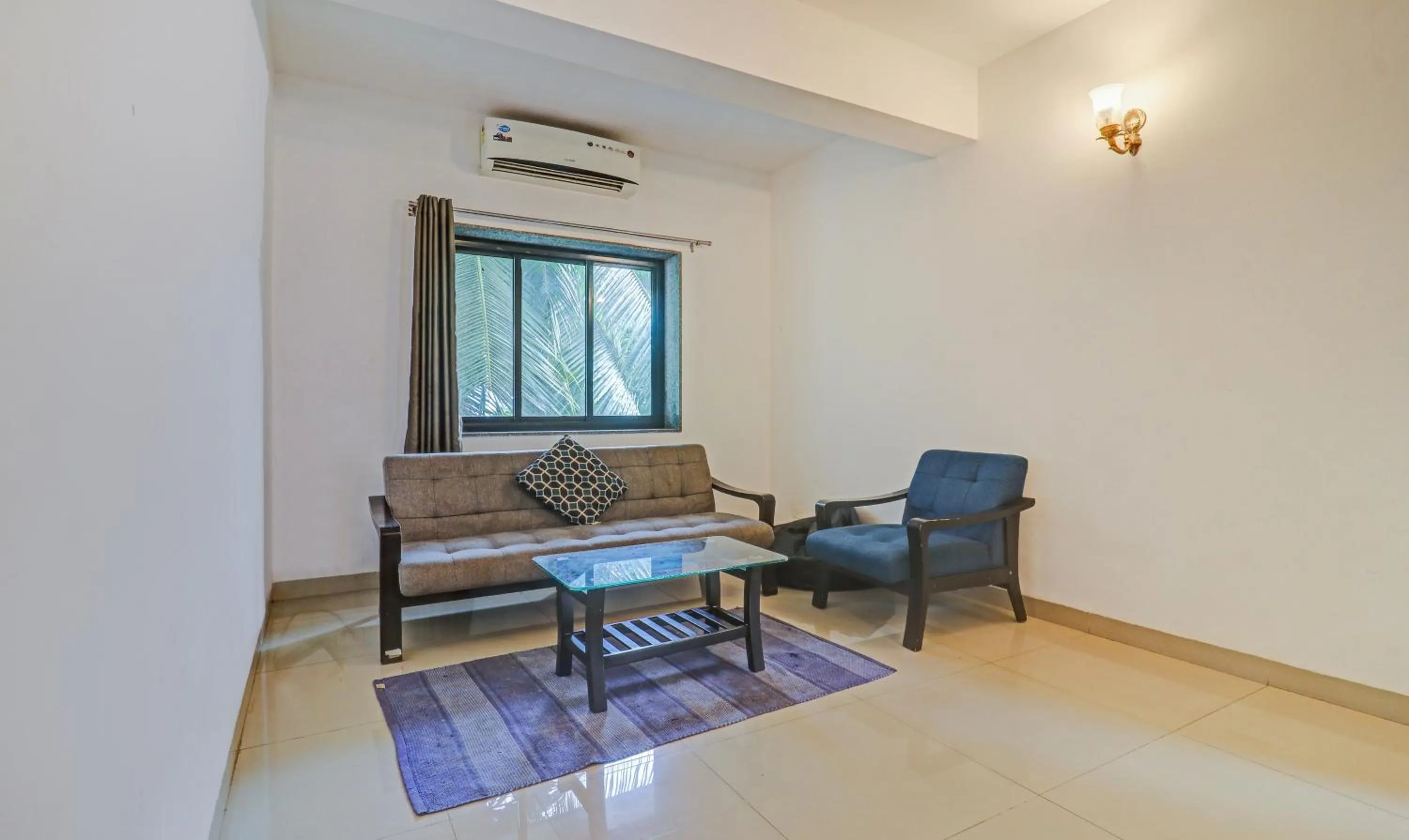 Seating area in Treebo Aquamarine Arpora With Pool