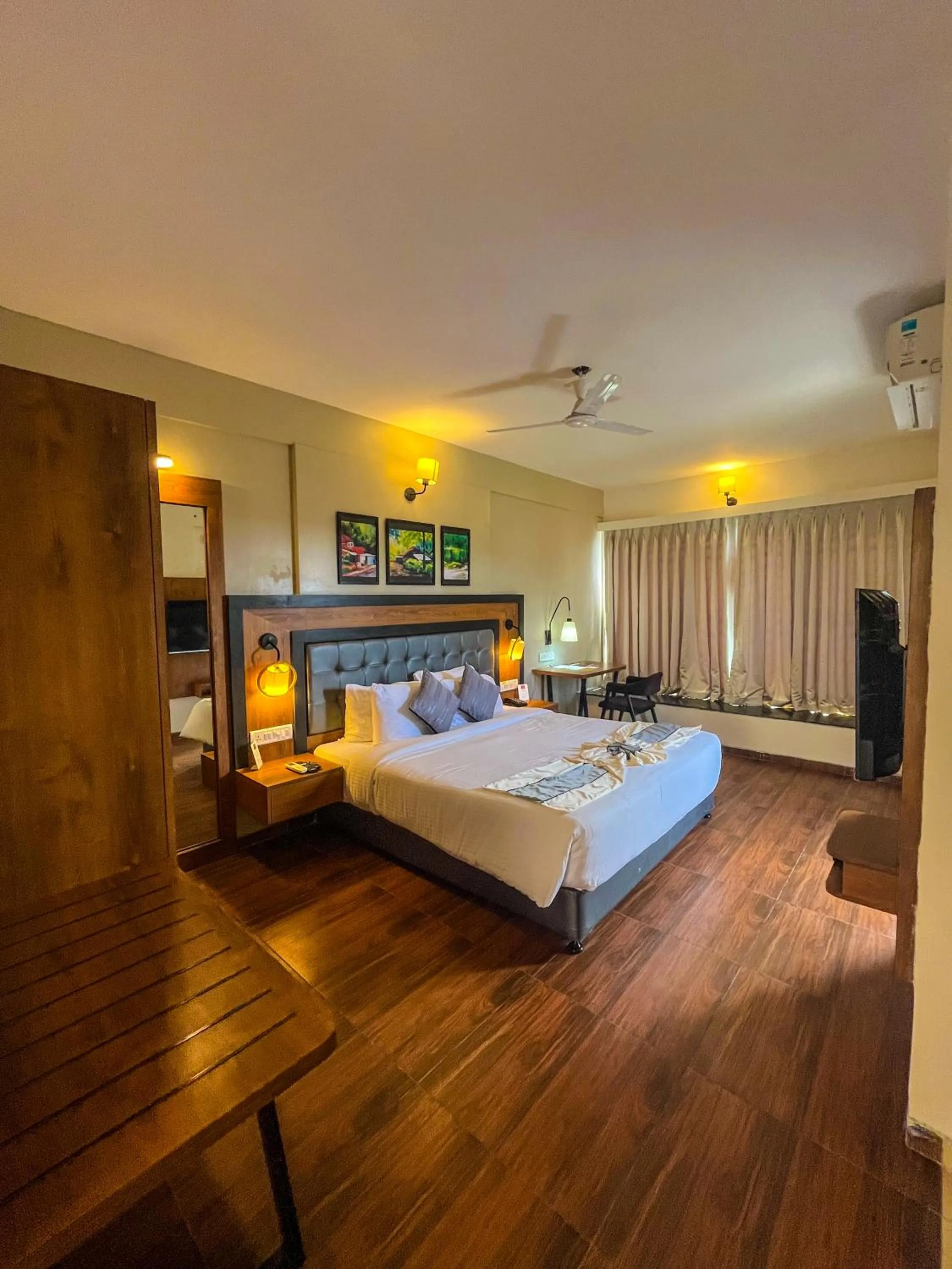 Communal lounge/ TV room, Bed in Pushpam Sanskruti Resort Karjat