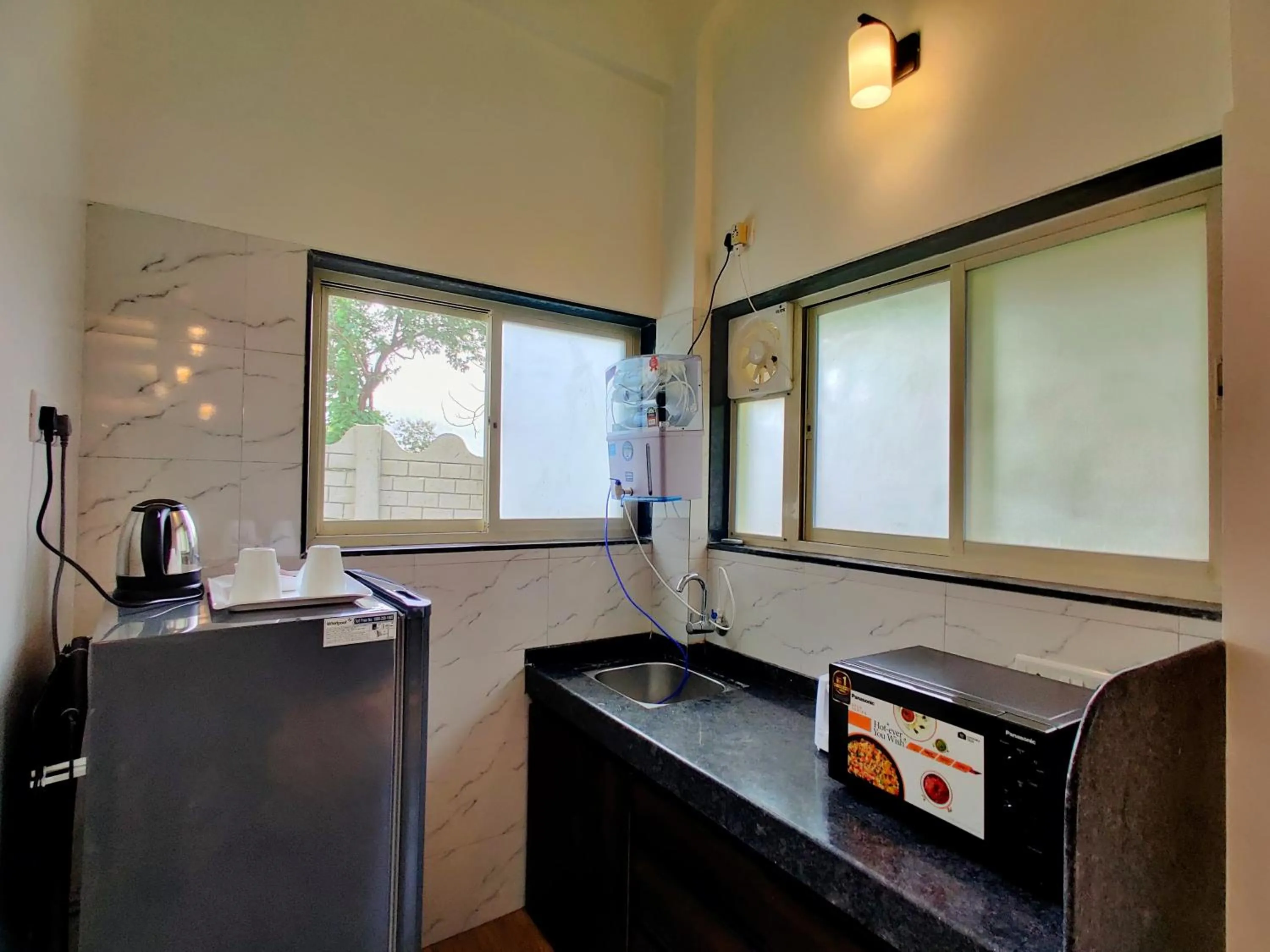 Kitchen or kitchenette in Pushpam Sanskruti Resort Karjat