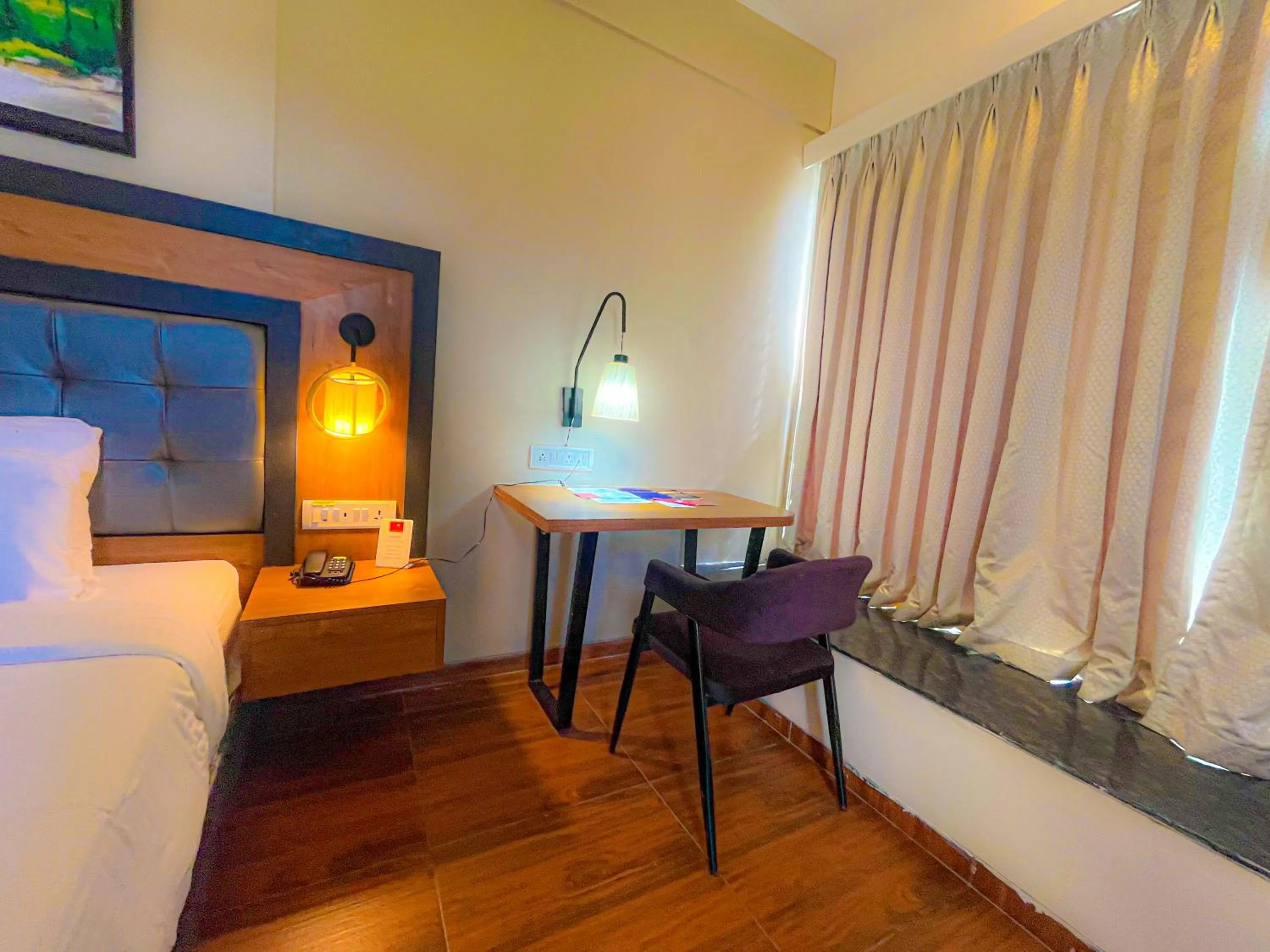 Seating area, Bed in Pushpam Sanskruti Resort Karjat