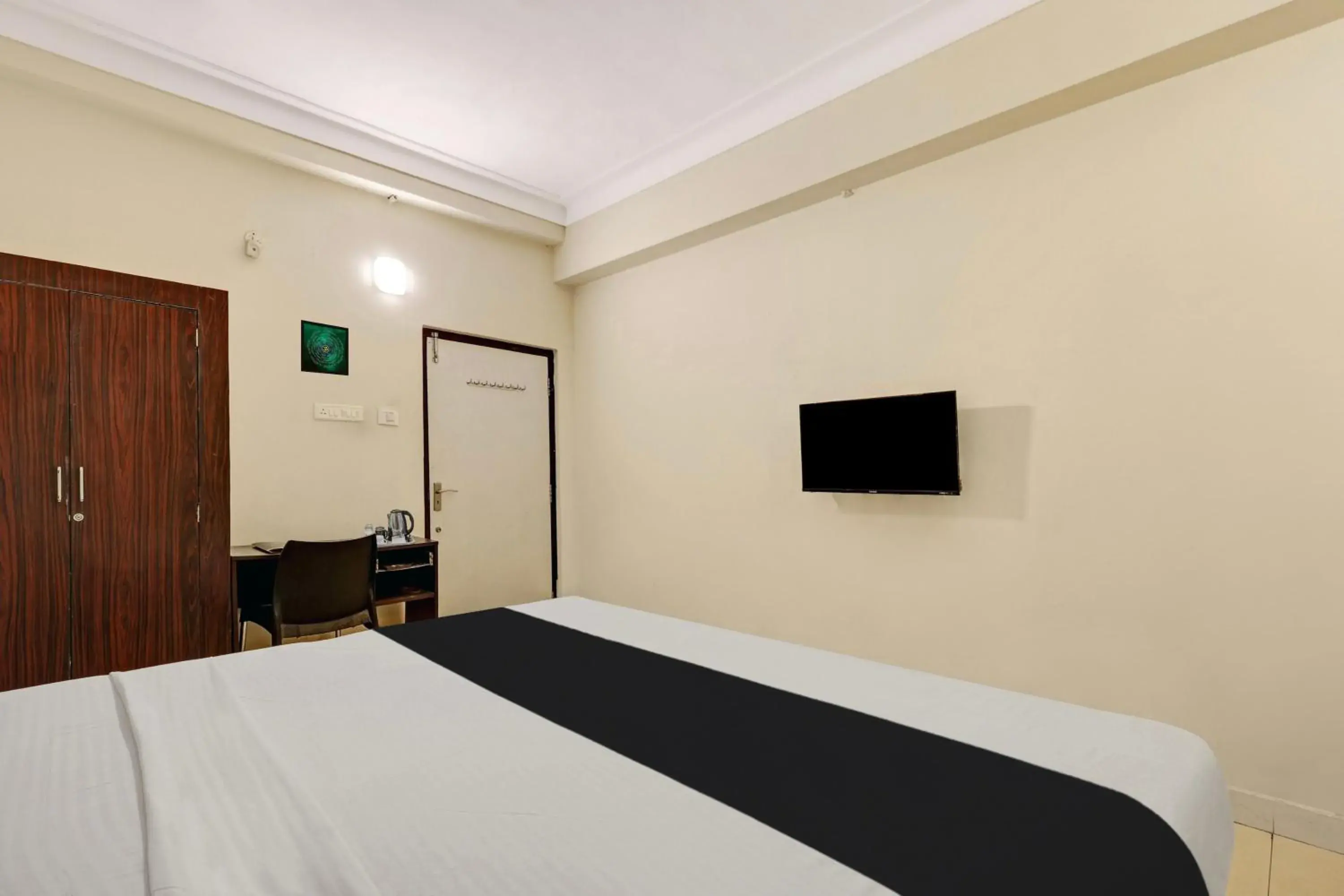 Bedroom, Bed in Super Collection O jagadamba Junction near Beach Road Bedroom, Bed in Super Collection O jagadamba Junction near Beach Road