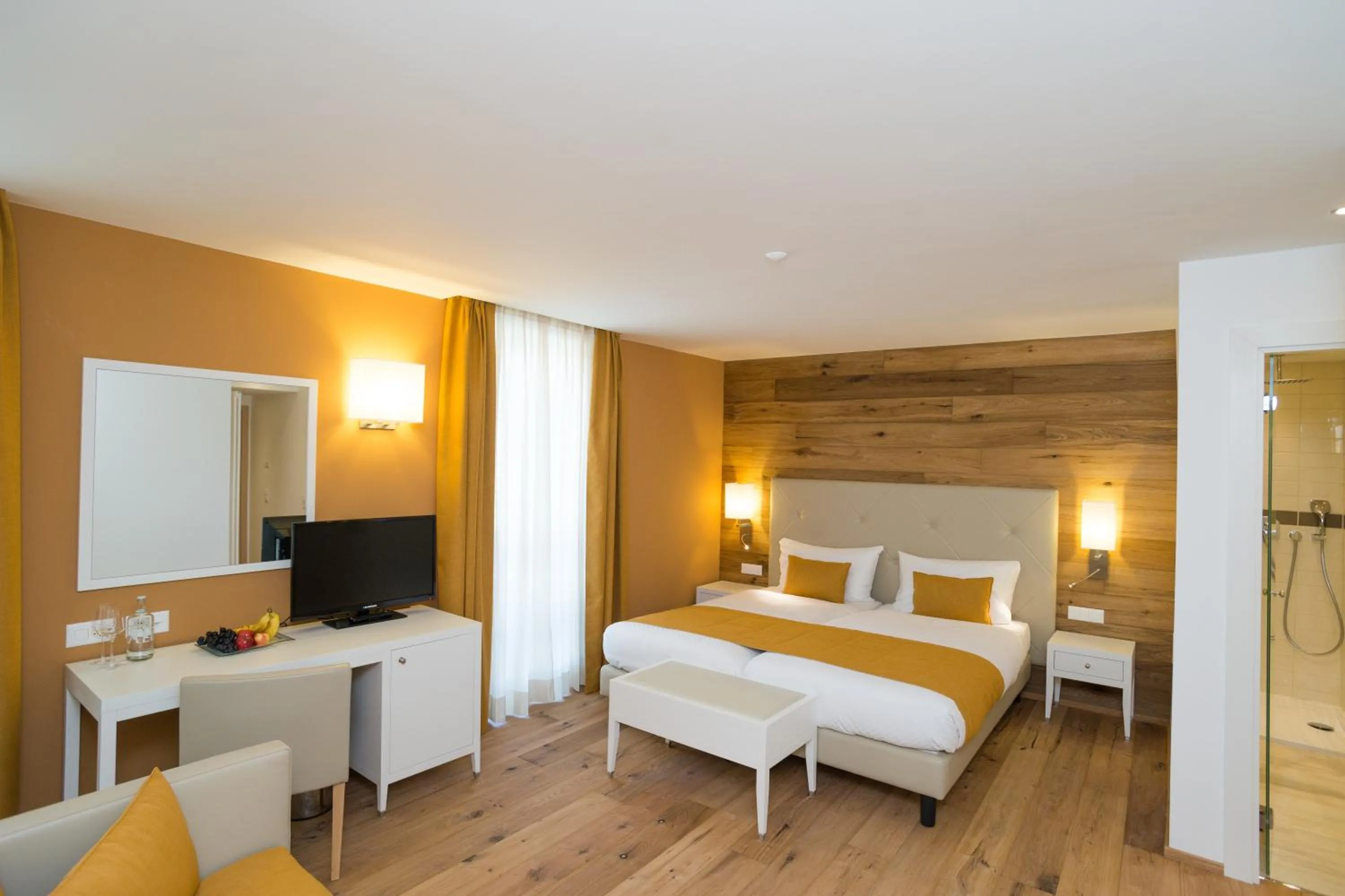 Photo of the whole room, Bed in Hotel Schweizerhof Pontresina