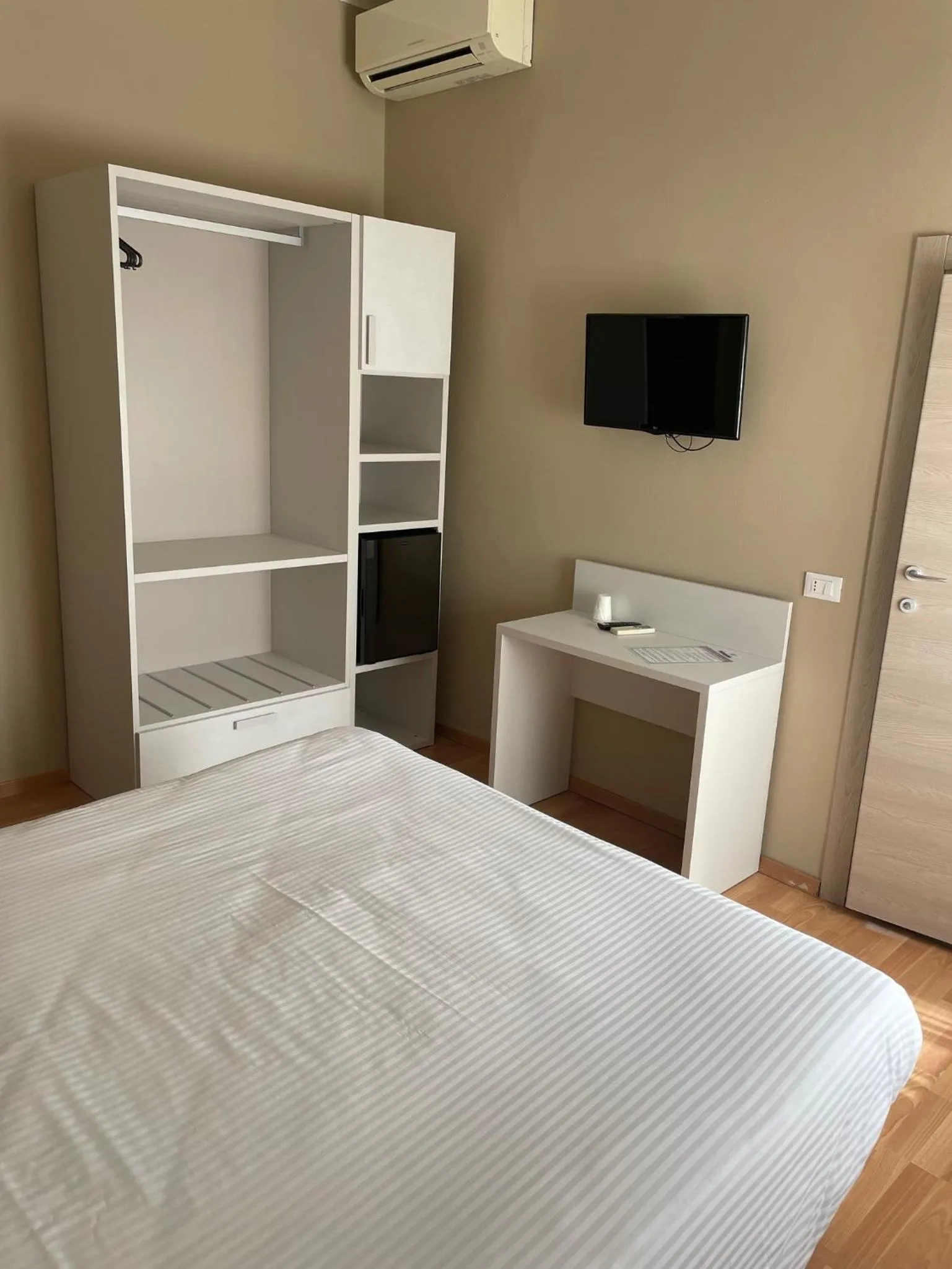 Bed in Piccolo Hotel