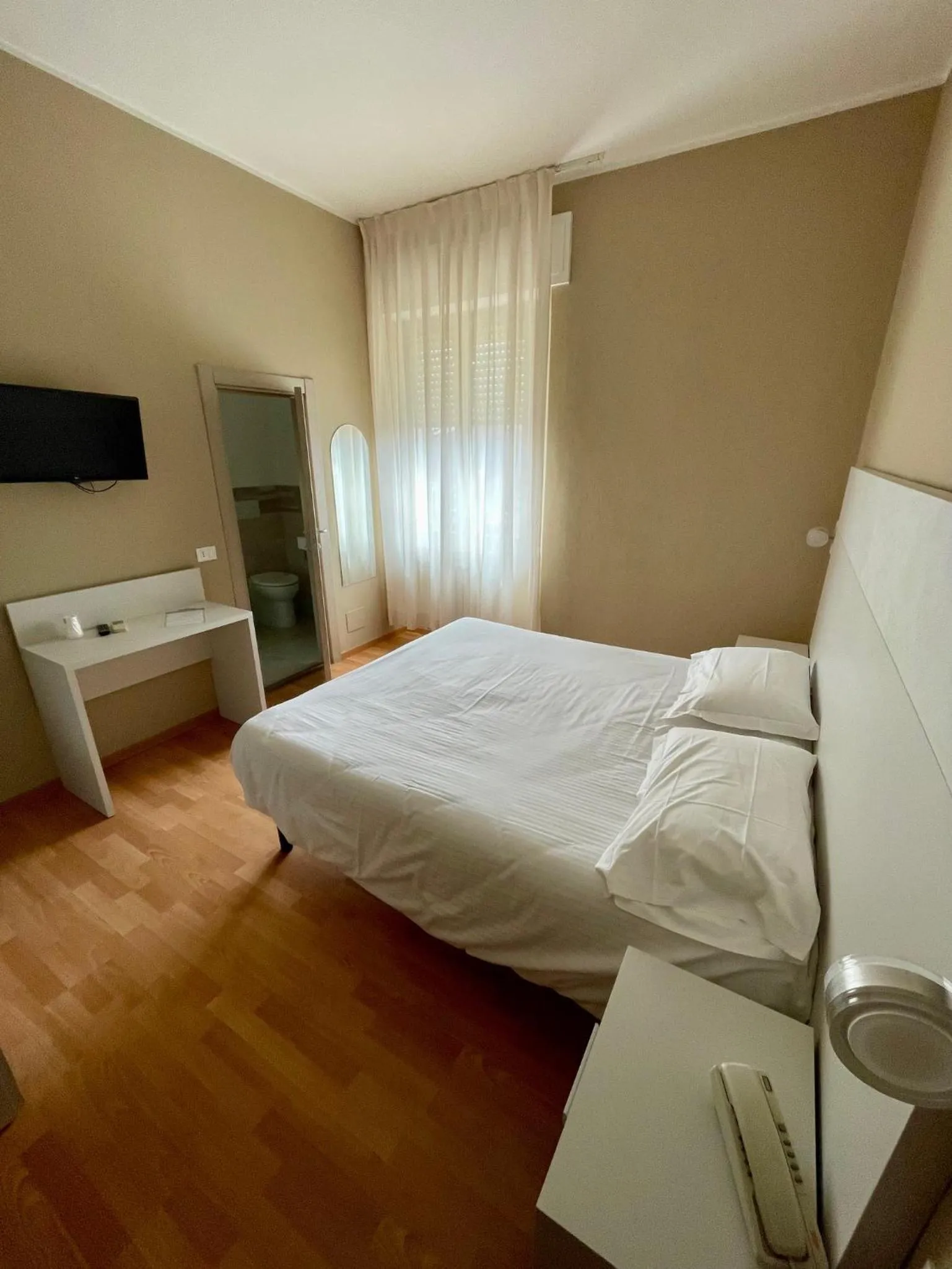 Bed in Piccolo Hotel