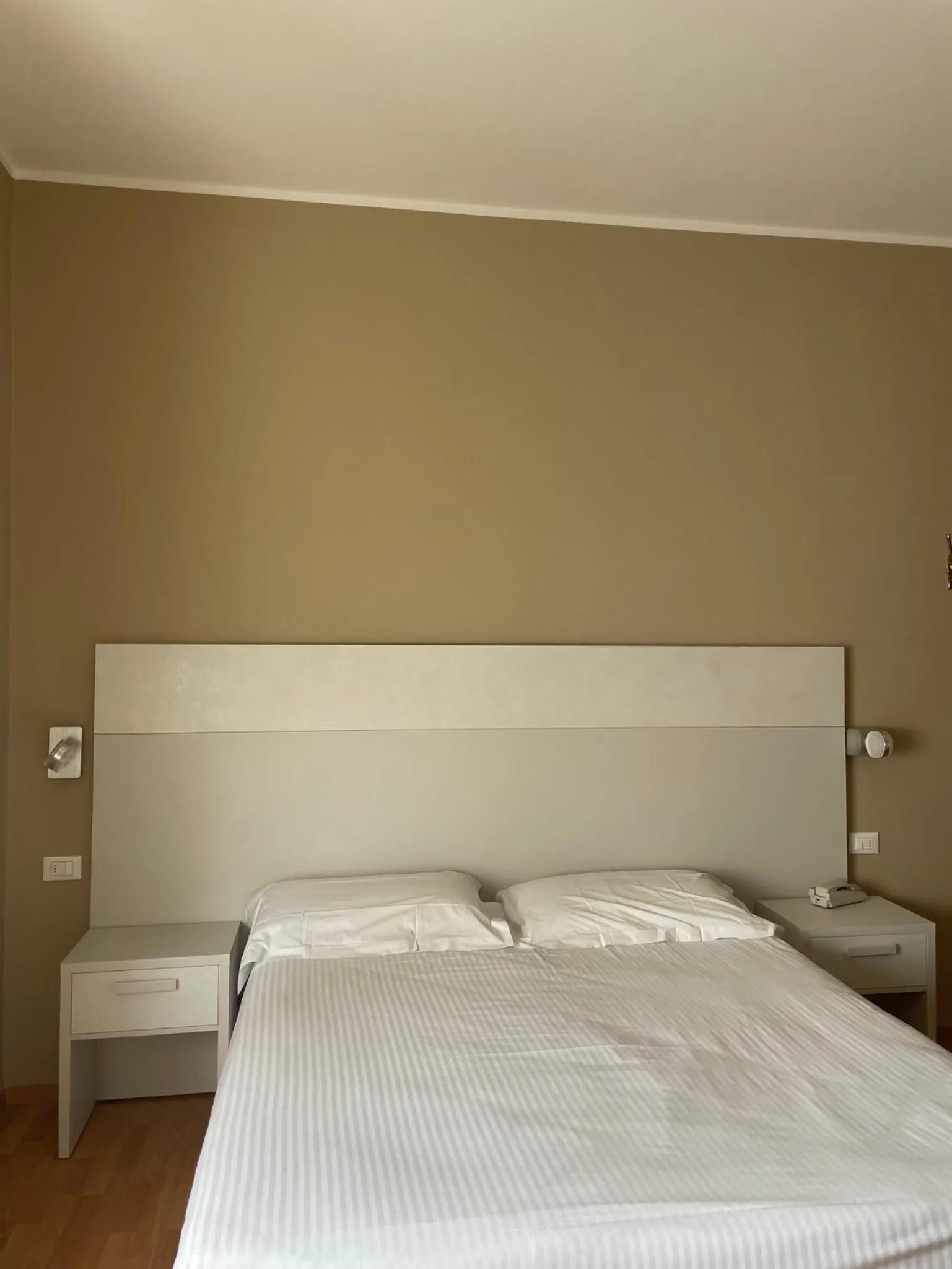 Bed in Piccolo Hotel