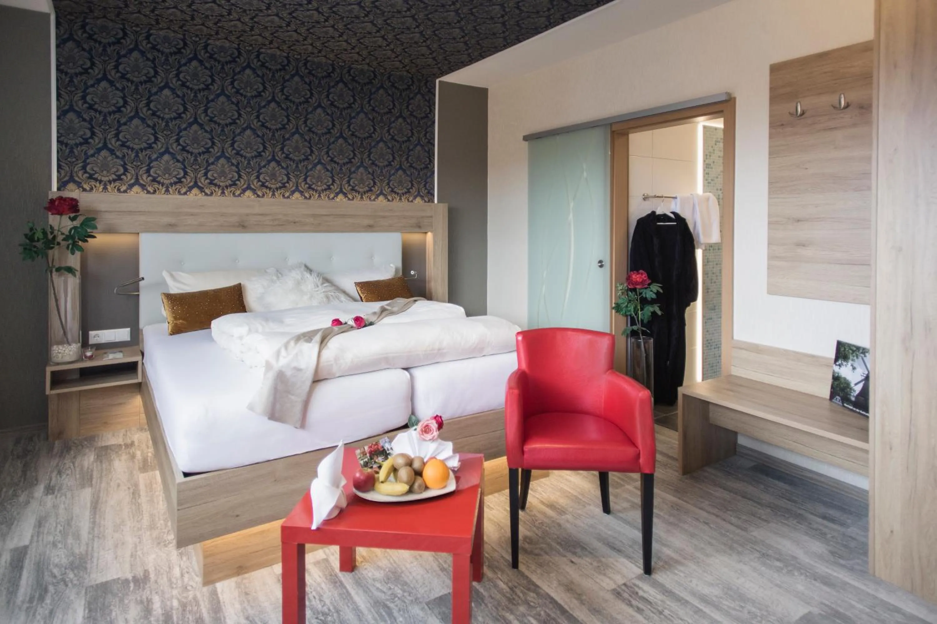 Seating area, Bed in Schwiizeralp Hotel & Restaurant