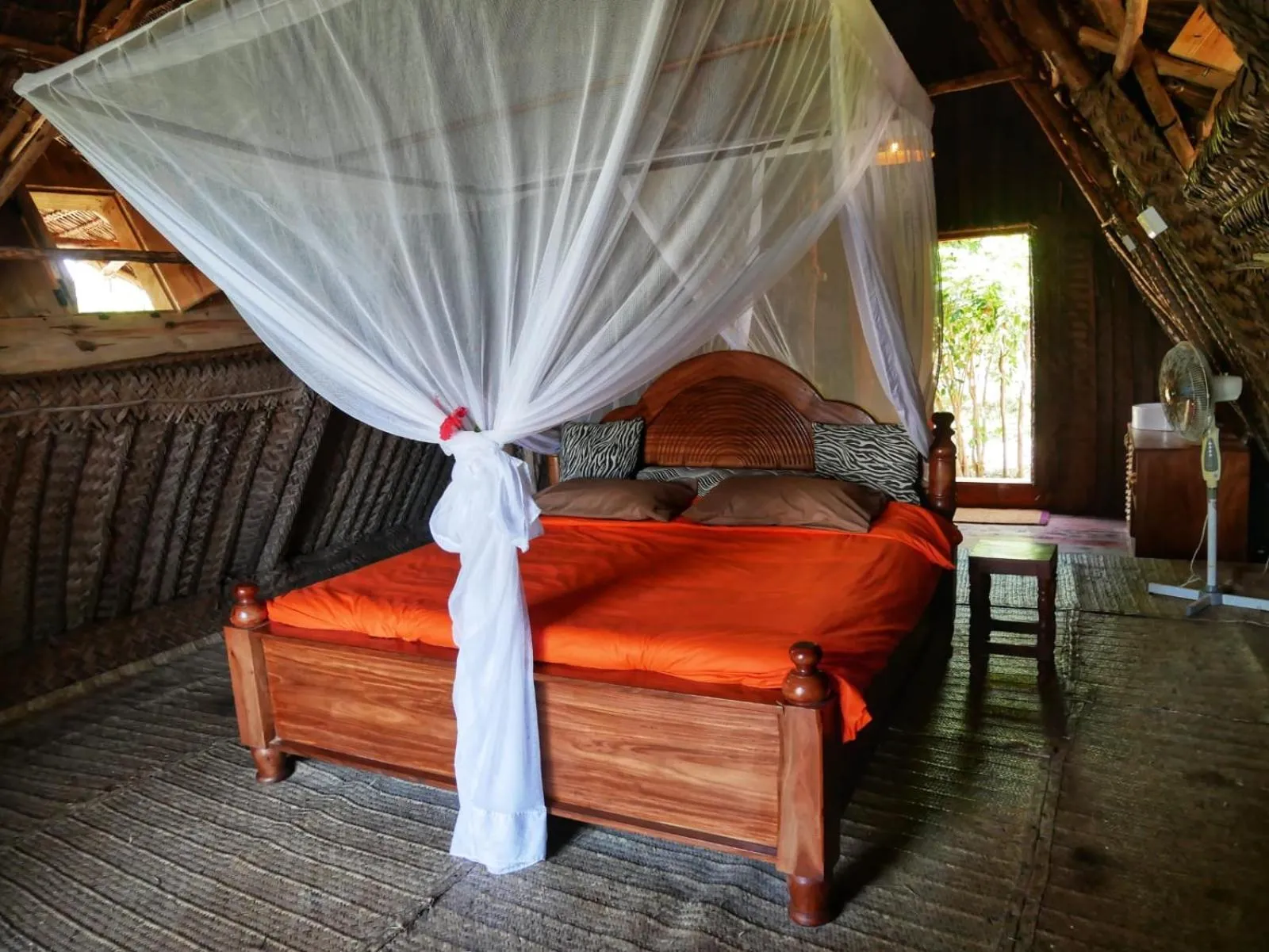 Bed in COCO REEF ECOLODGE