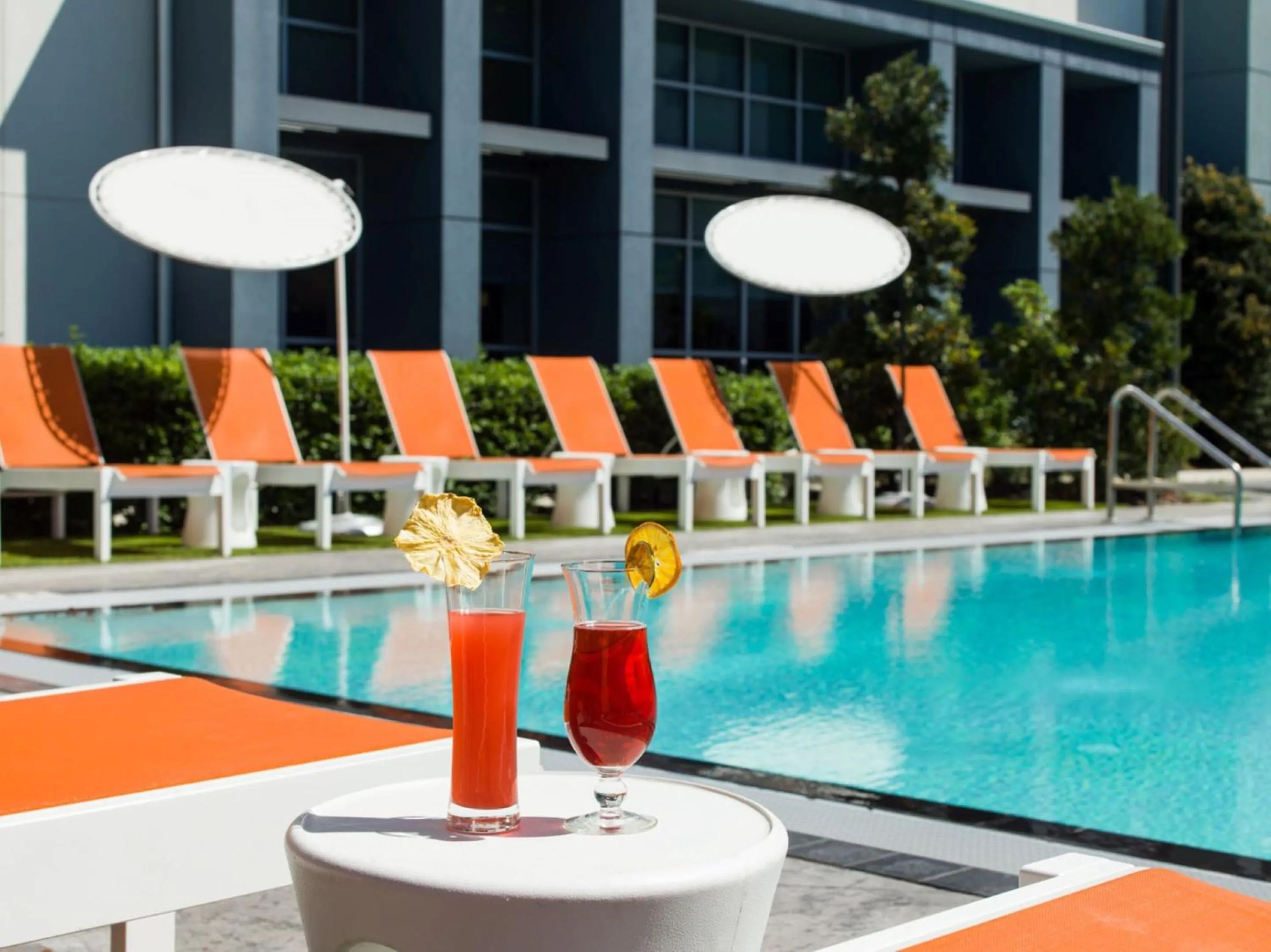 Swimming pool in Aloft Orlando International Drive by Marriott