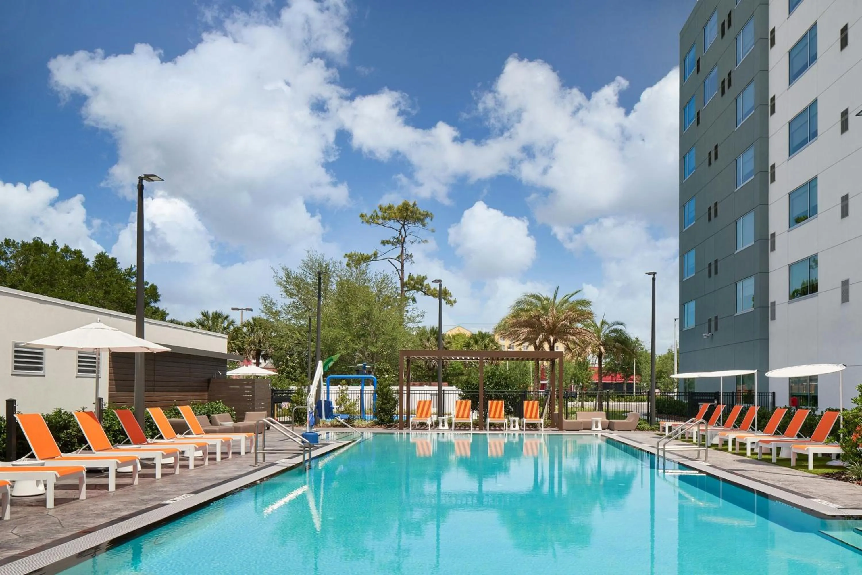 Swimming pool in Aloft Orlando International Drive by Marriott
