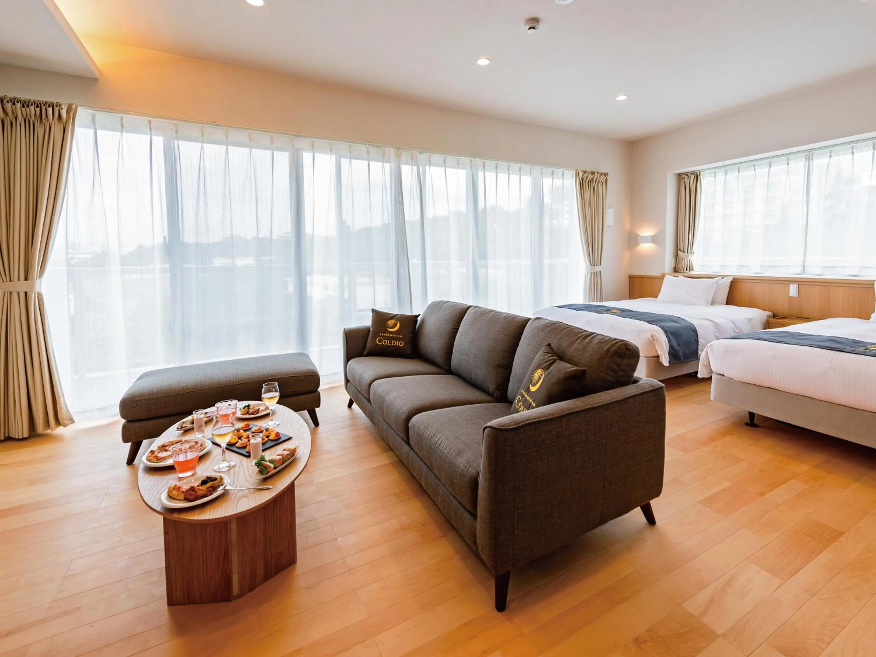 Living room, Bed in Private Condo Chatan Jagaru by Coldio Premium