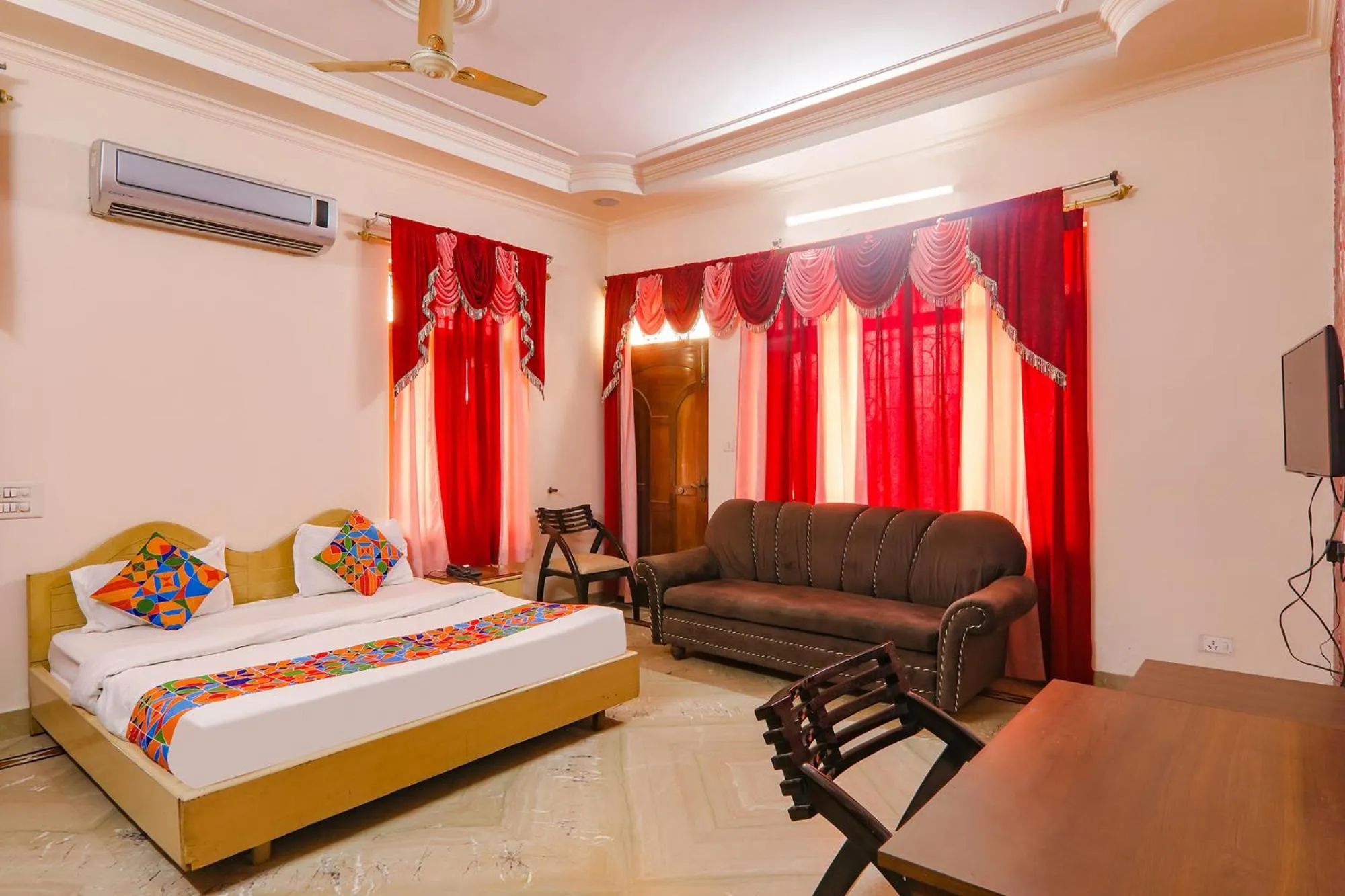 Bed in FabHotel Raka Inn