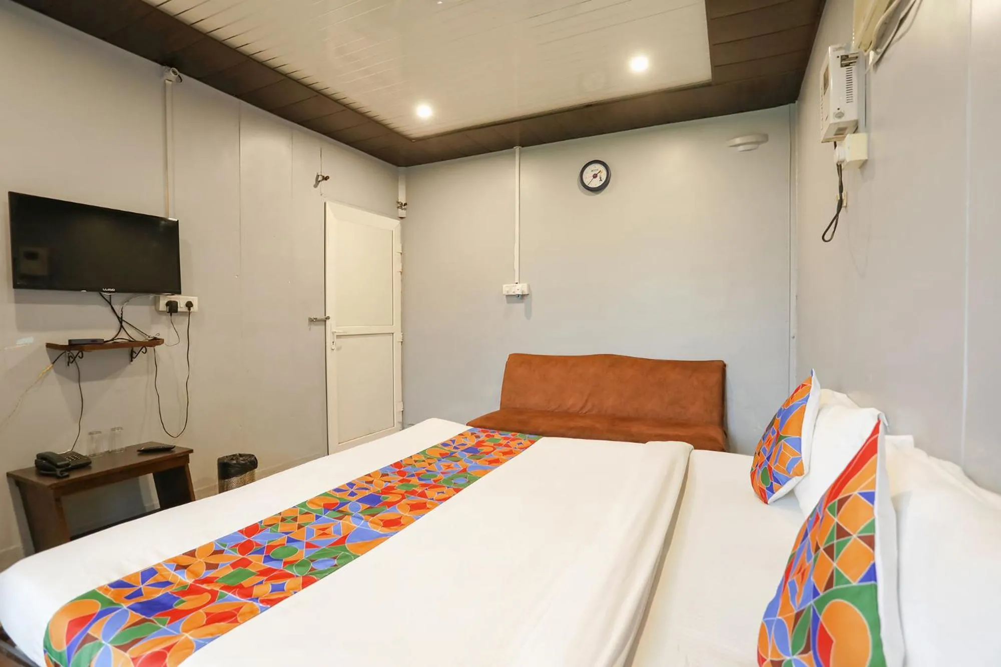 Bed in FabHotel Raka Inn