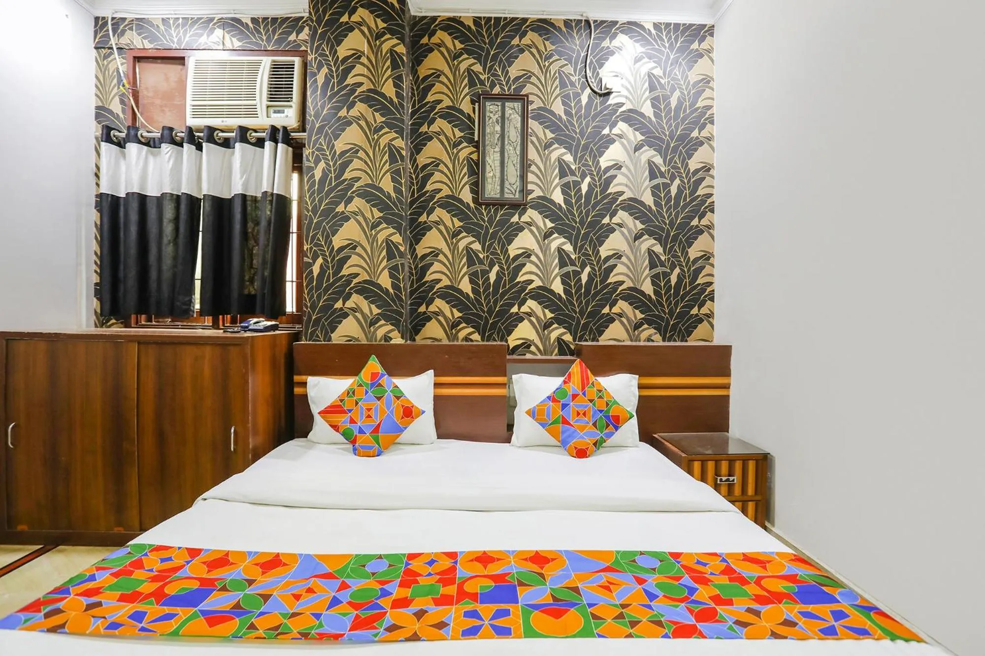 Bed in FabHotel Raka Inn