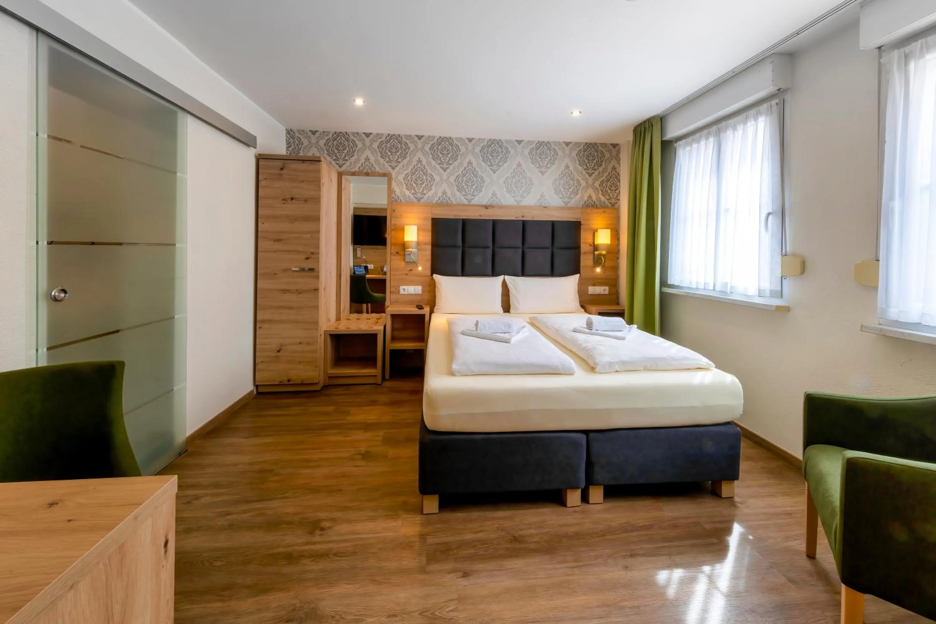 Bed in AKZENT Hotel Restaurant Roter Ochse Rhens bei Koblenz