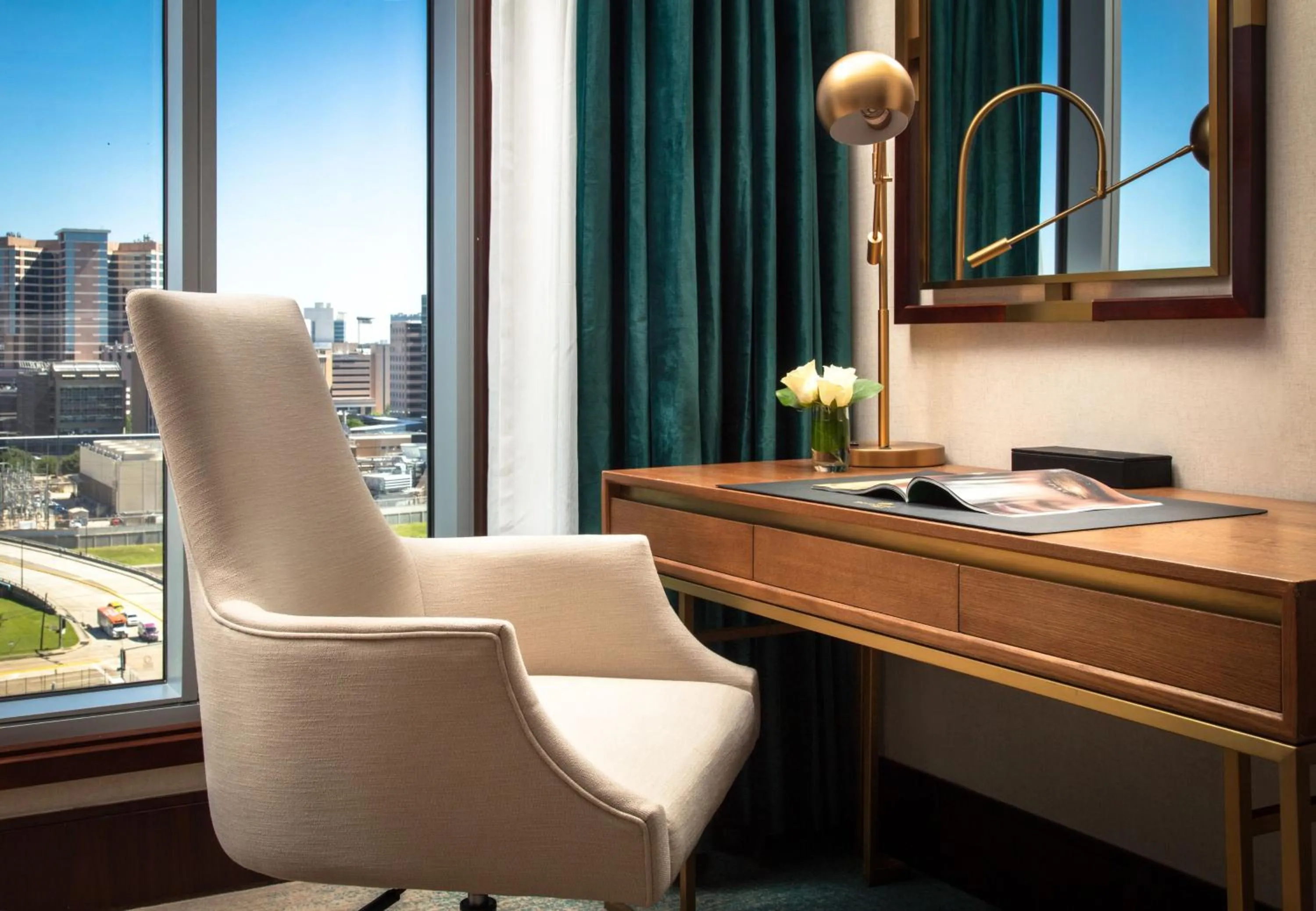 Living room in Blossom Hotel Houston, Curio Collection by Hilton