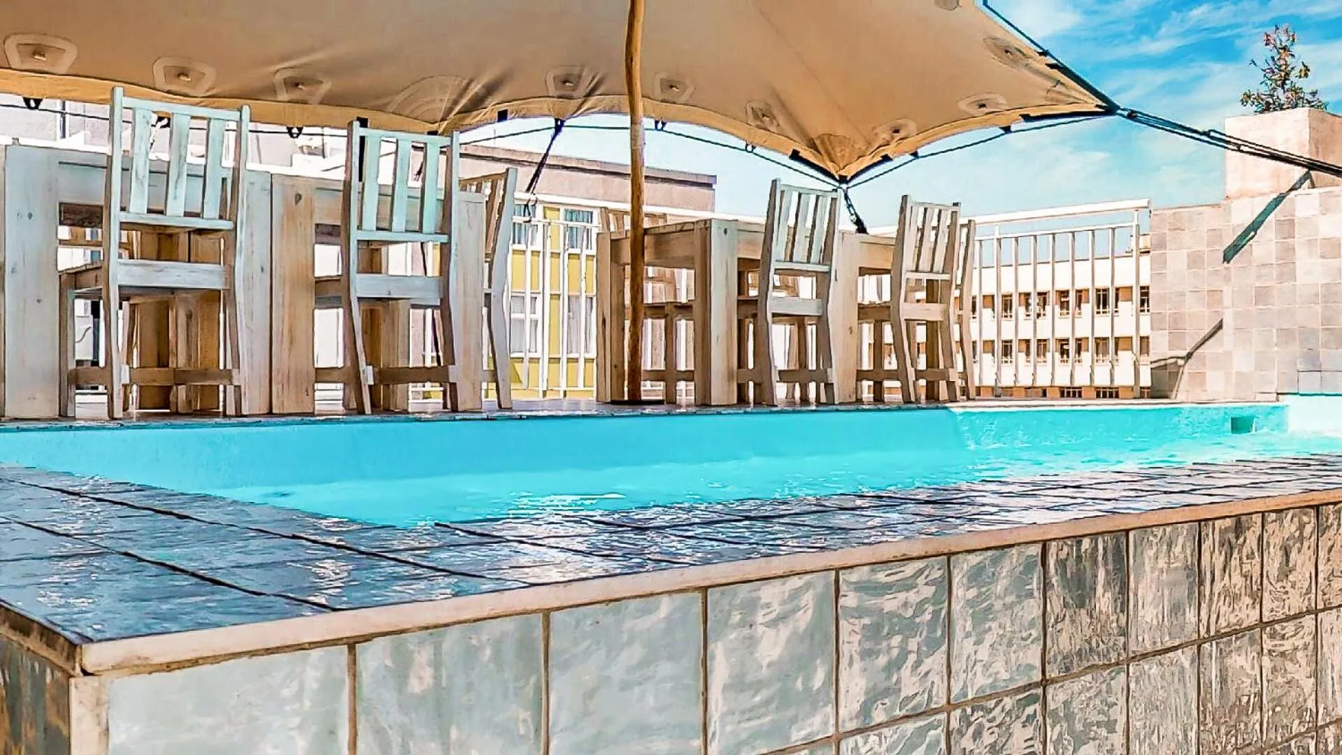 Swimming pool in Urban Oasis Aparthotel