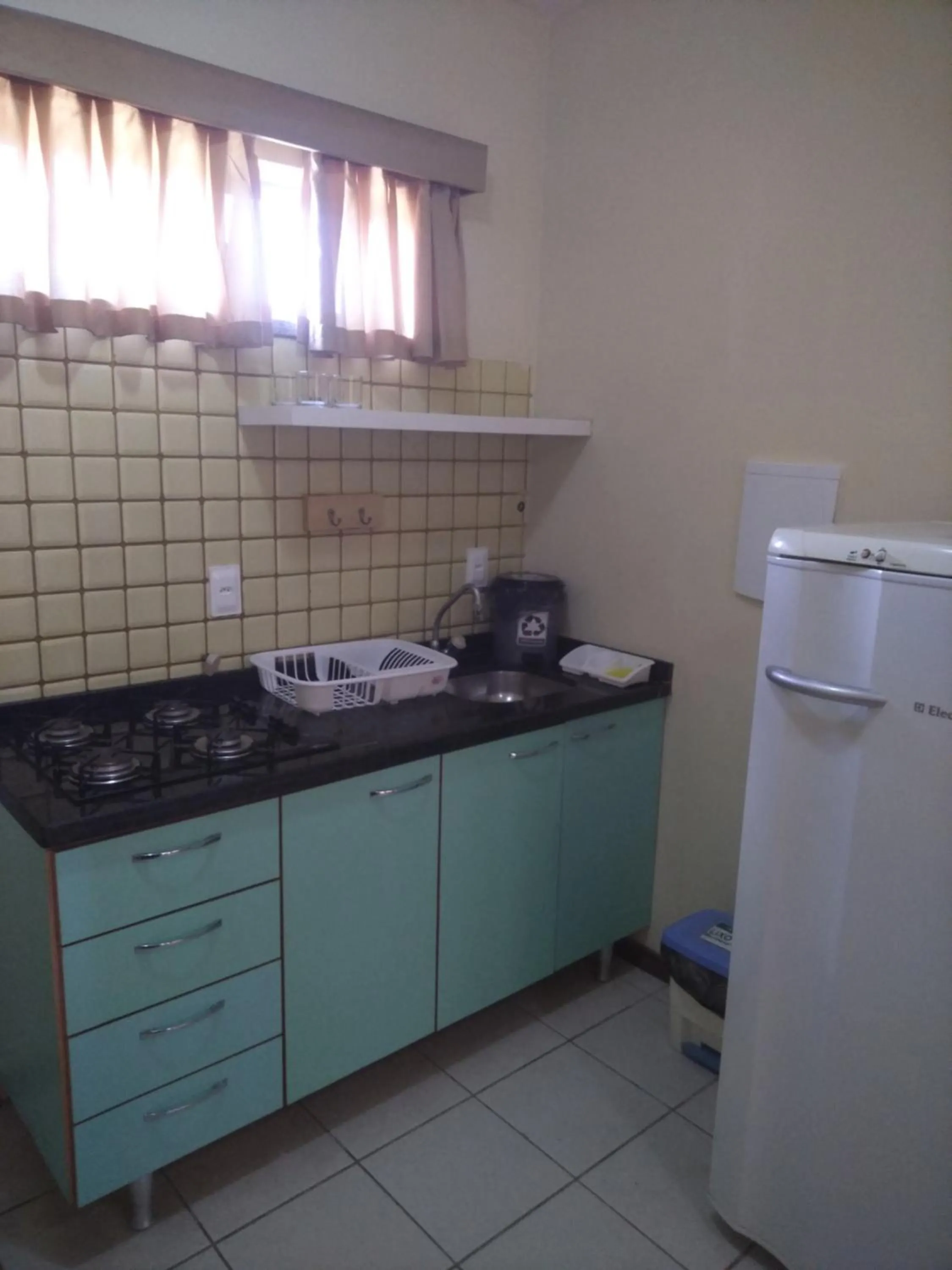 Kitchen or kitchenette in Condomínio Flat La Perla
