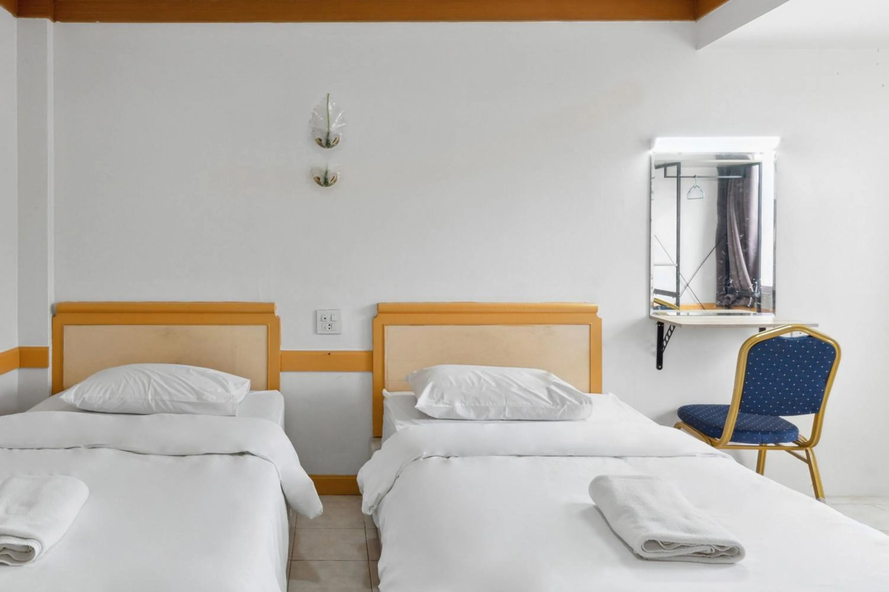 Bed in Phu Inn Hotel