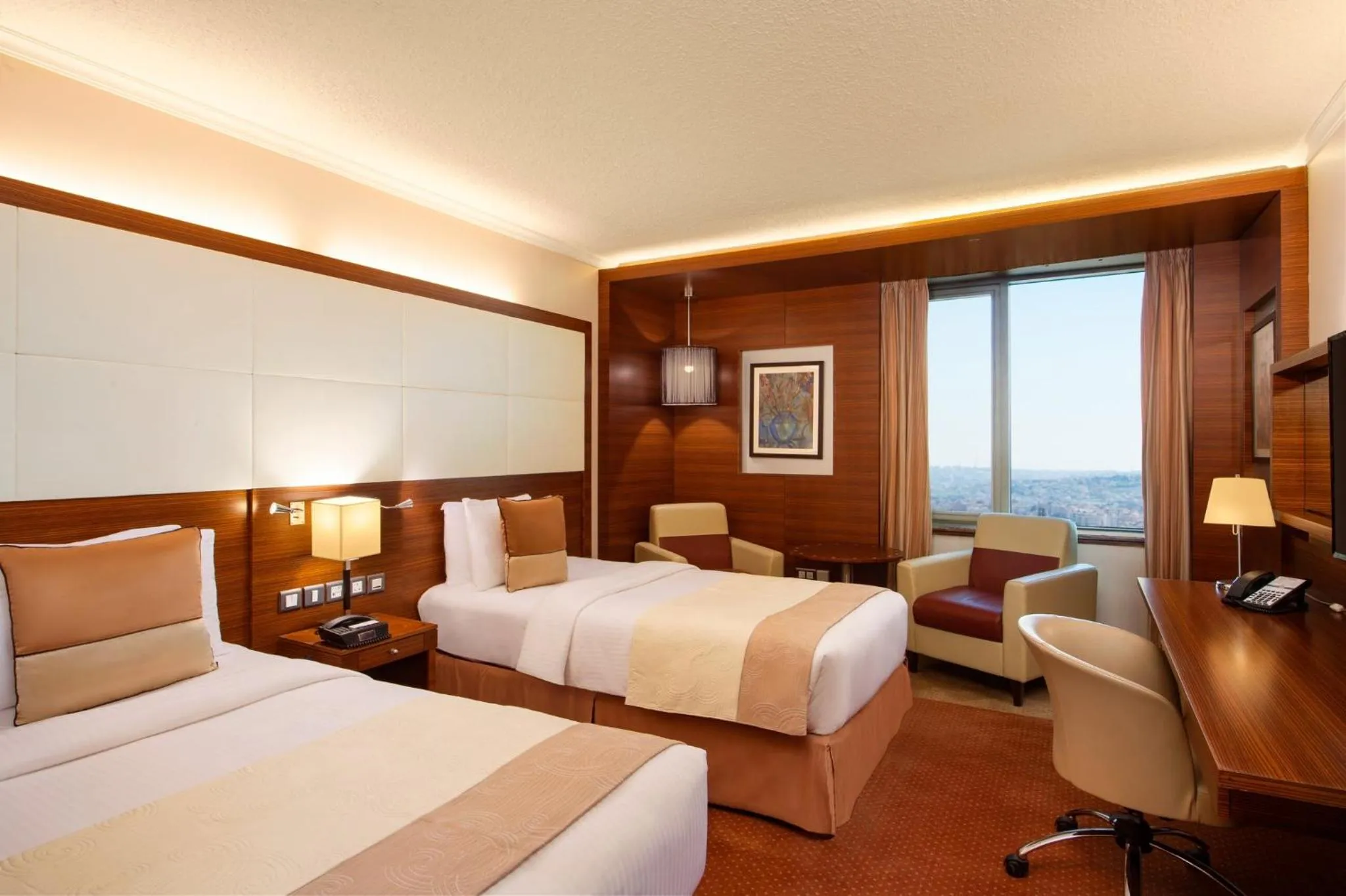 Photo of the whole room, Bed in Crowne Plaza Amman by IHG