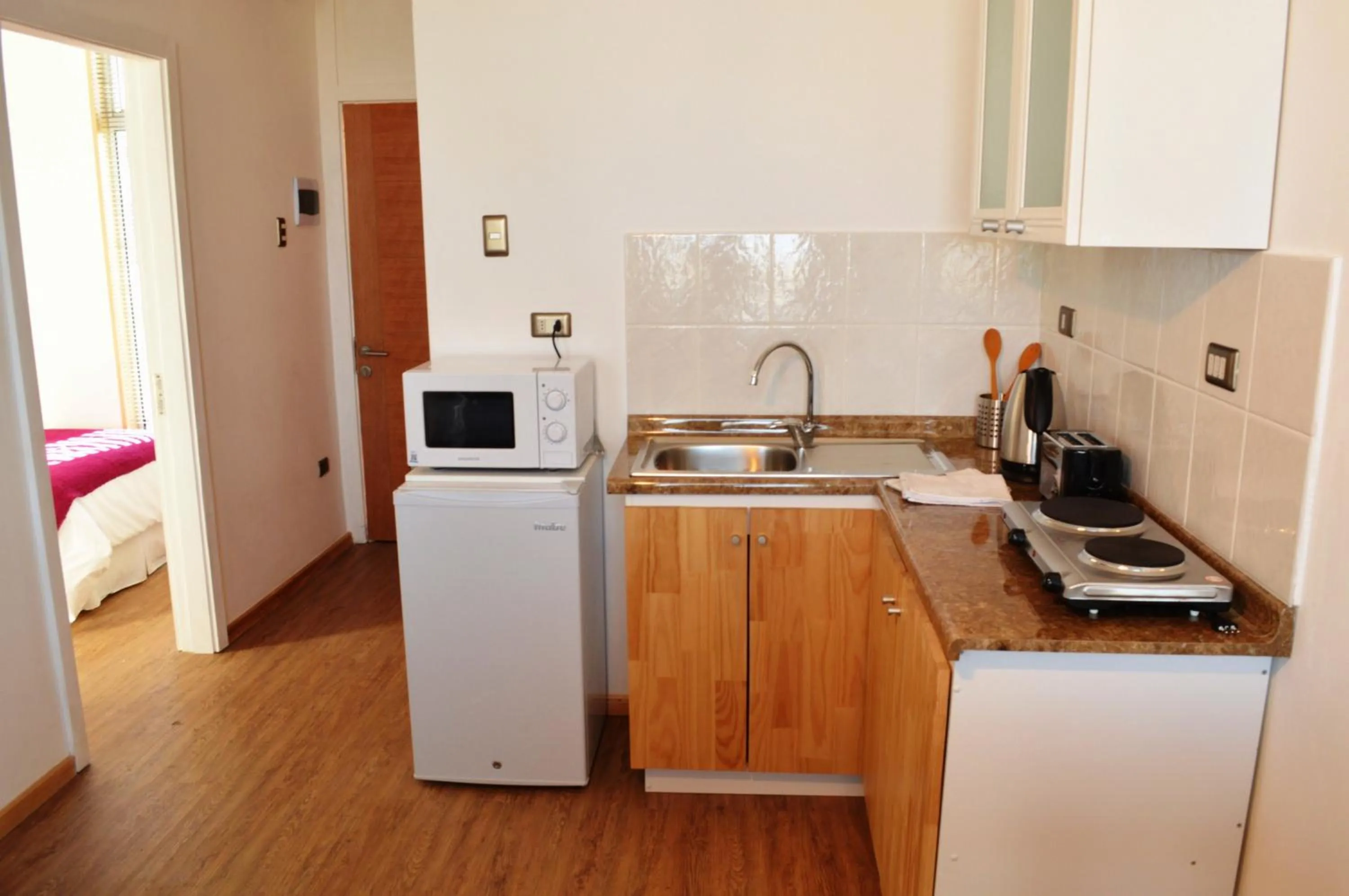 Kitchen or kitchenette in Apart Hotel Quillango