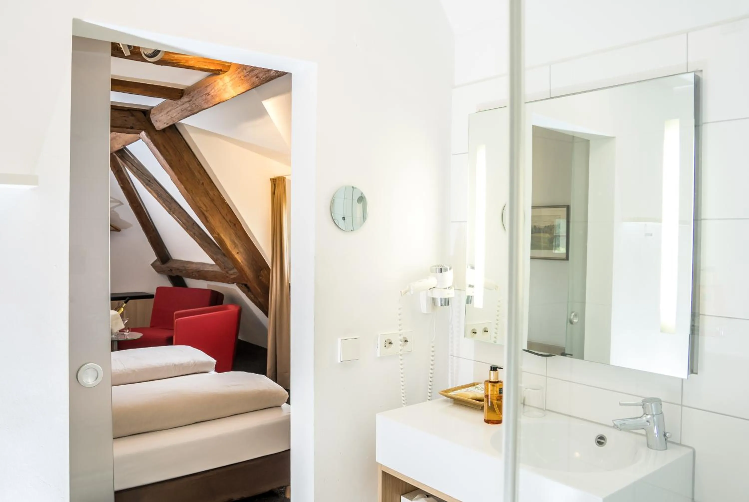 Bathroom, Bed in Hotel Hofgut Hohenkarpfen